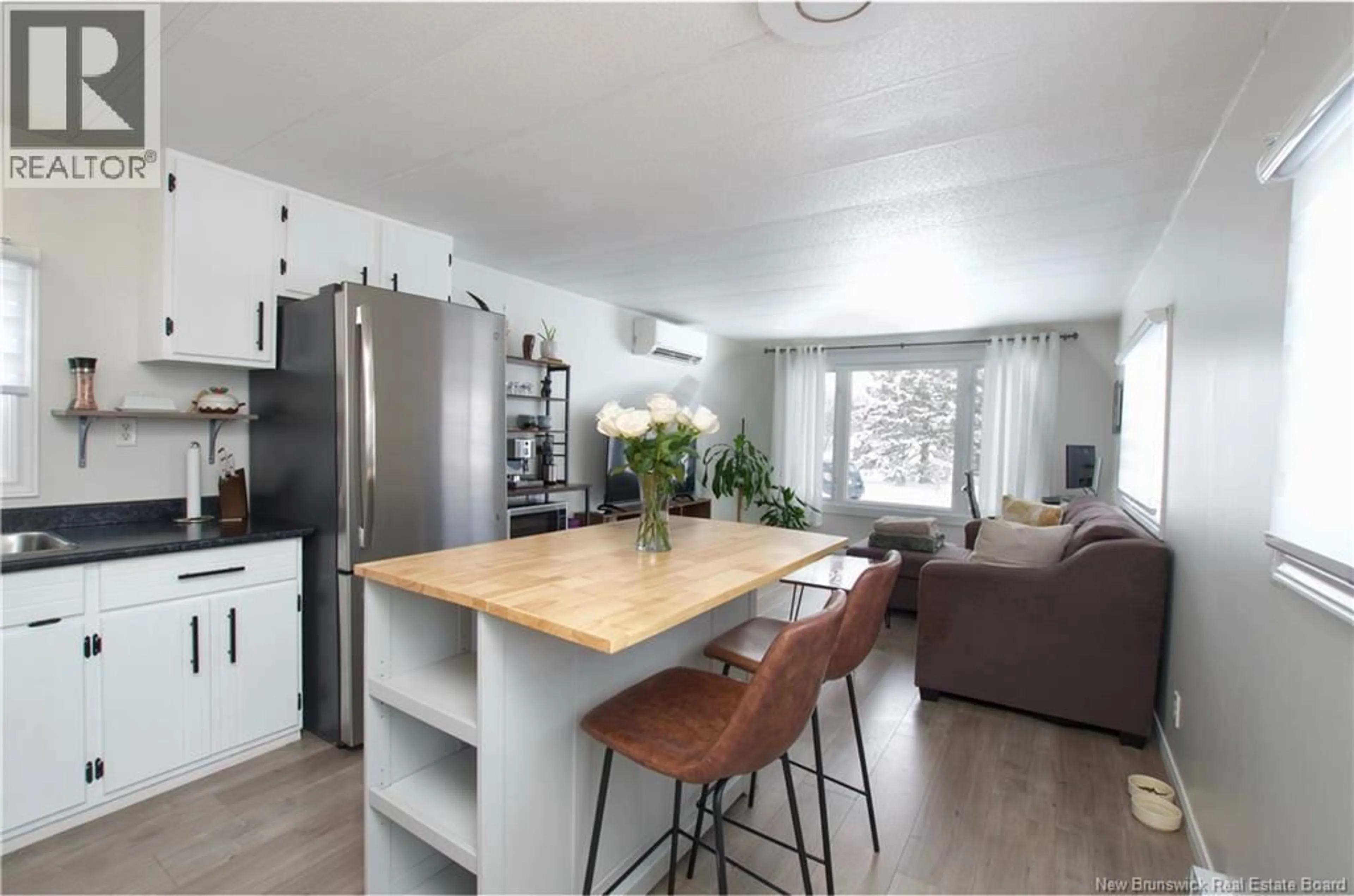 Open concept kitchen, wood/laminate floor for 8 THIRD STREET, Lakeville New Brunswick E1H1K7