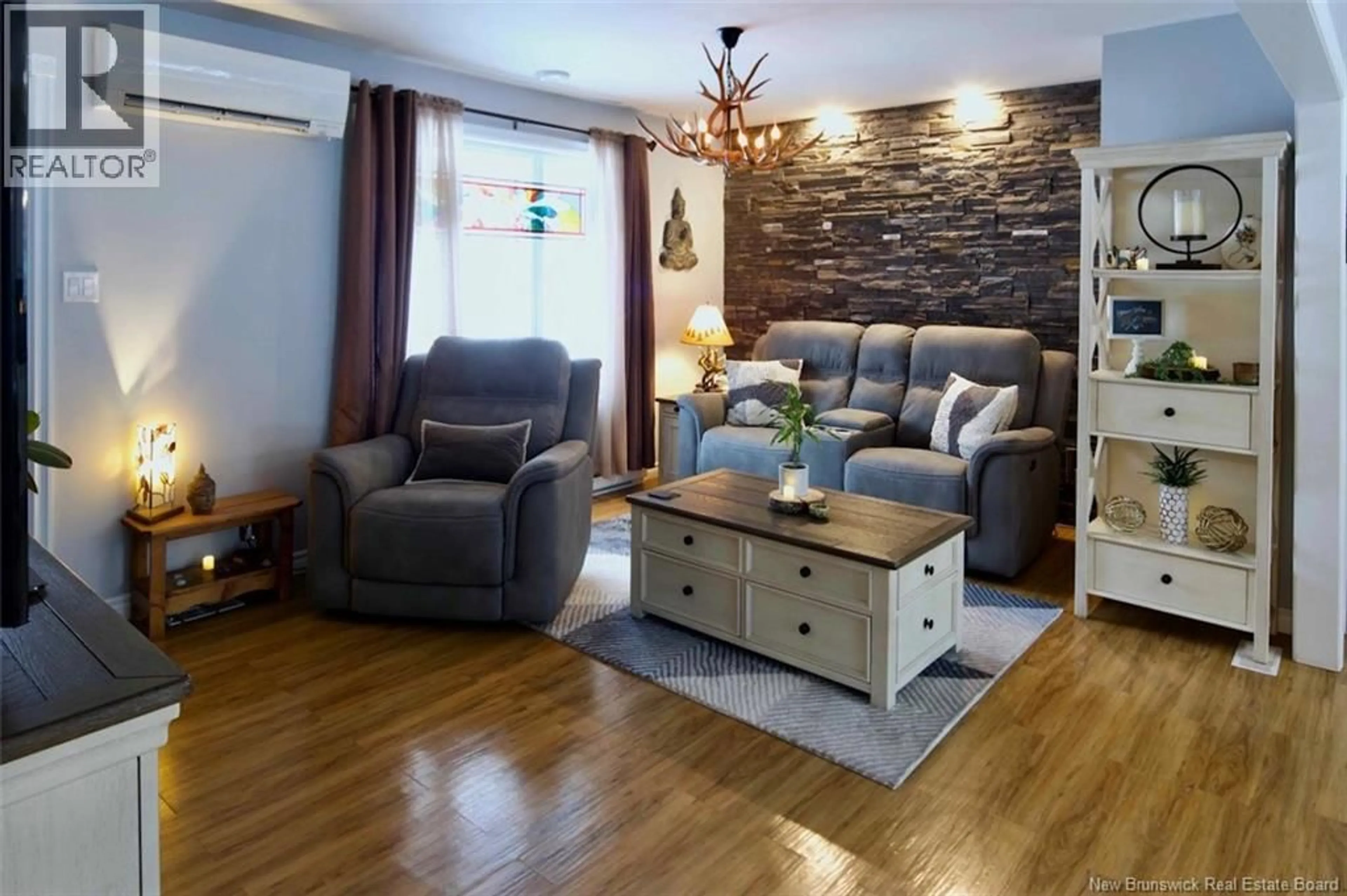 Living room with furniture, wood/laminate floor for 174 RICEVILLE ROAD, Edmundston New Brunswick E3V4S8
