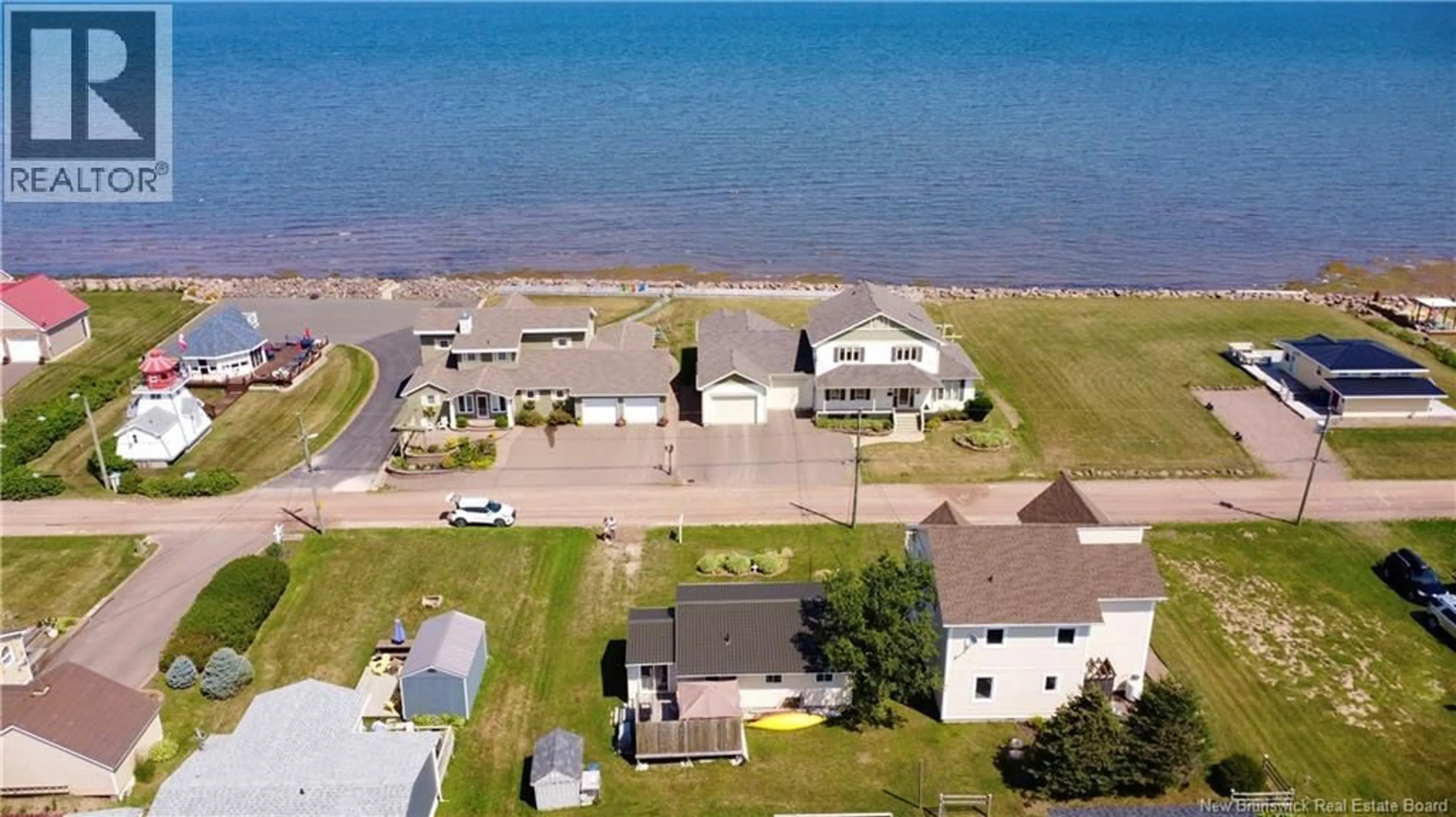 A pic from outside/outdoor area/front of a property/back of a property/a pic from drone, water/lake/river/ocean view for 33 SUR L'OCEAN, Grand-Barachois New Brunswick E4P8P1