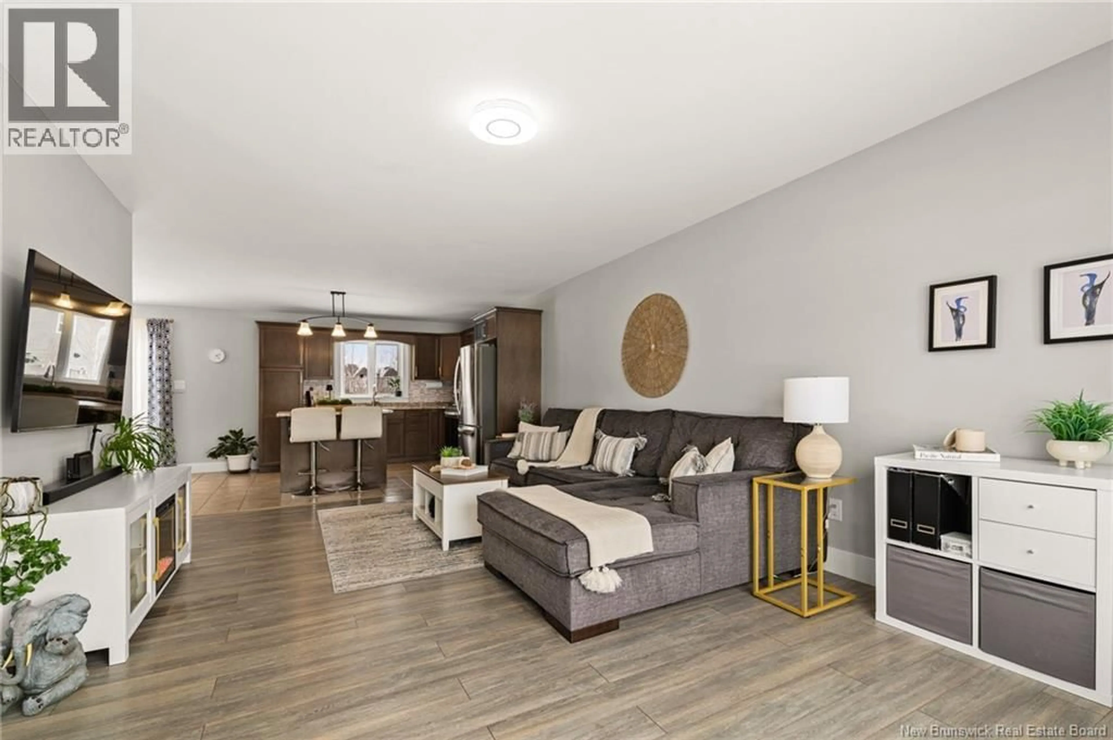 Living room with furniture, wood/laminate floor for 23 GAMBIA STREET, Moncton New Brunswick E1G5S7