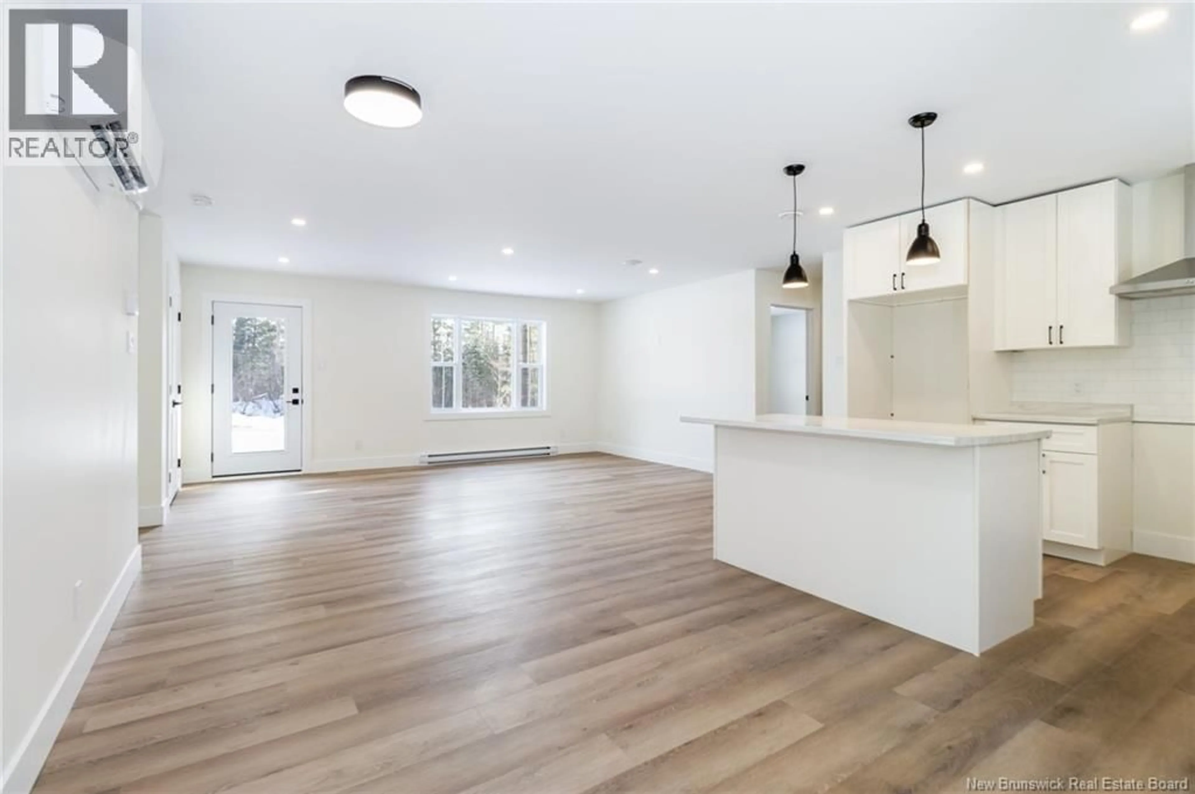 Open concept kitchen, wood/laminate floor for 45 SISSON SETTLEMENT, Keswick Ridge New Brunswick E6L2Y1