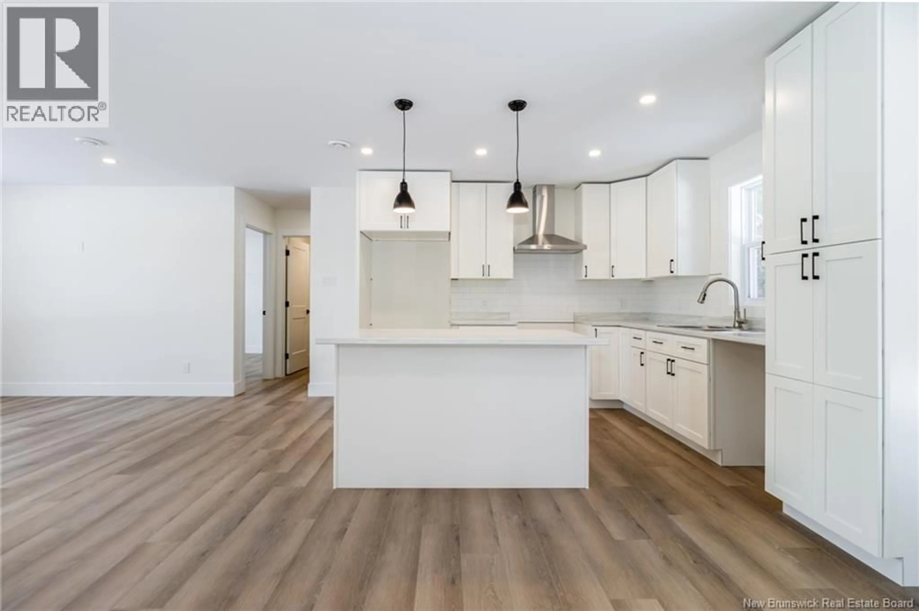 Open concept kitchen, wood/laminate floor for 45 SISSON SETTLEMENT, Keswick Ridge New Brunswick E6L2Y1