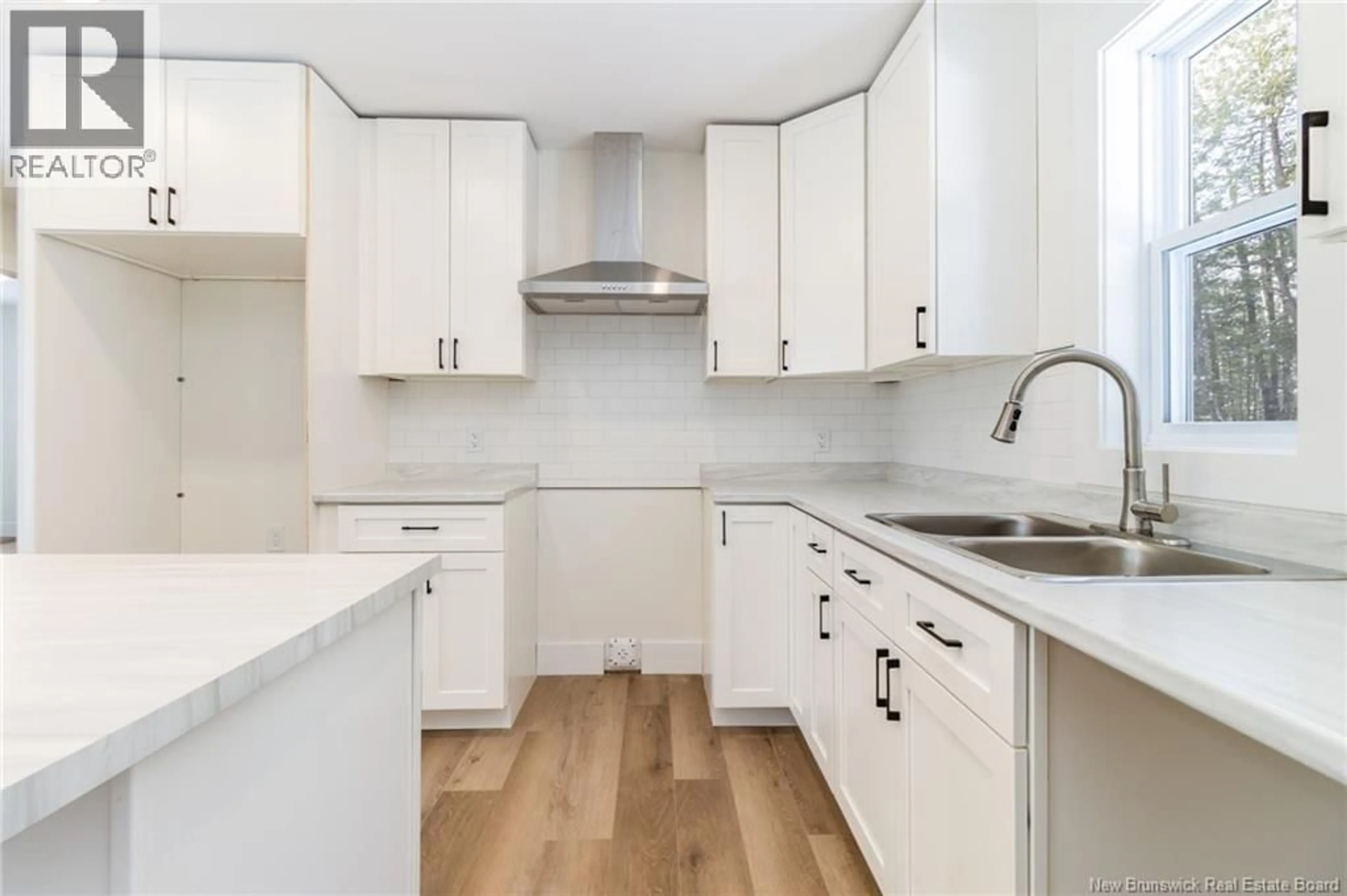 Open concept kitchen, wood/laminate floor for 45 SISSON SETTLEMENT, Keswick Ridge New Brunswick E6L2Y1