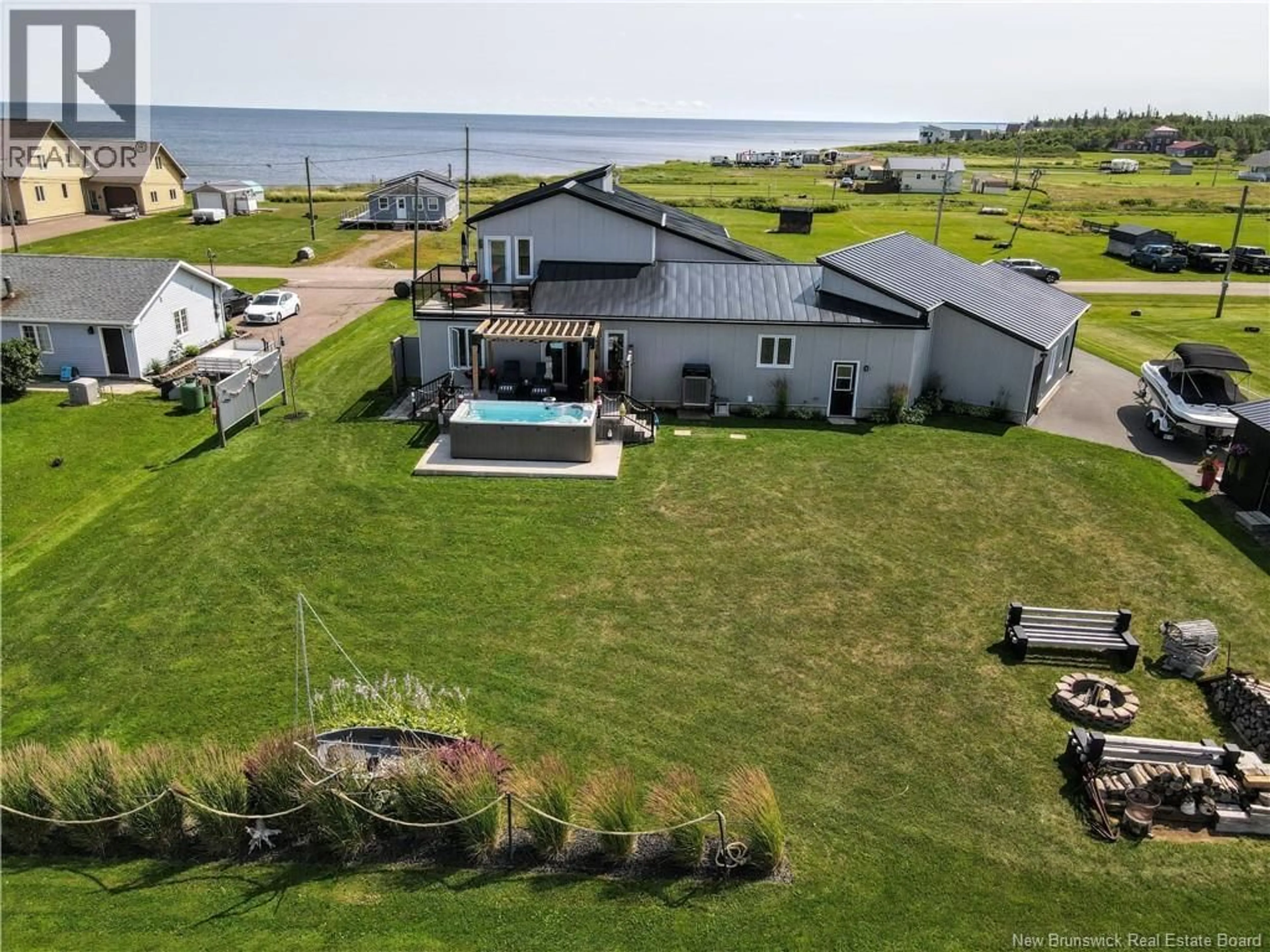 A pic from outside/outdoor area/front of a property/back of a property/a pic from drone, water/lake/river/ocean view for 52 CONNIE ROAD, Trois Ruisseaux New Brunswick E4N2V3