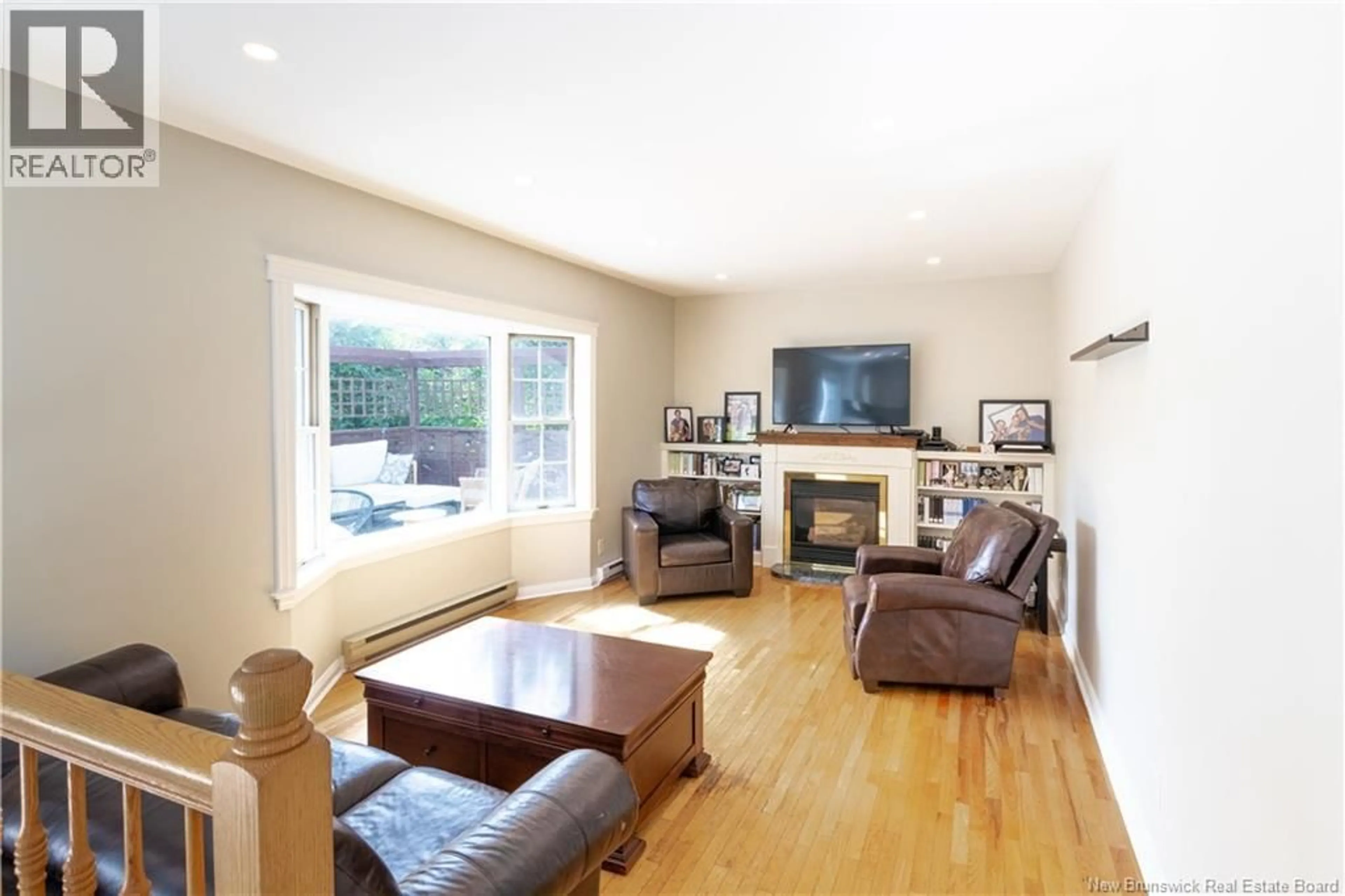 Living room with furniture, wood/laminate floor for 153 LEXINGTON LANE, Fredericton New Brunswick E3A5S7