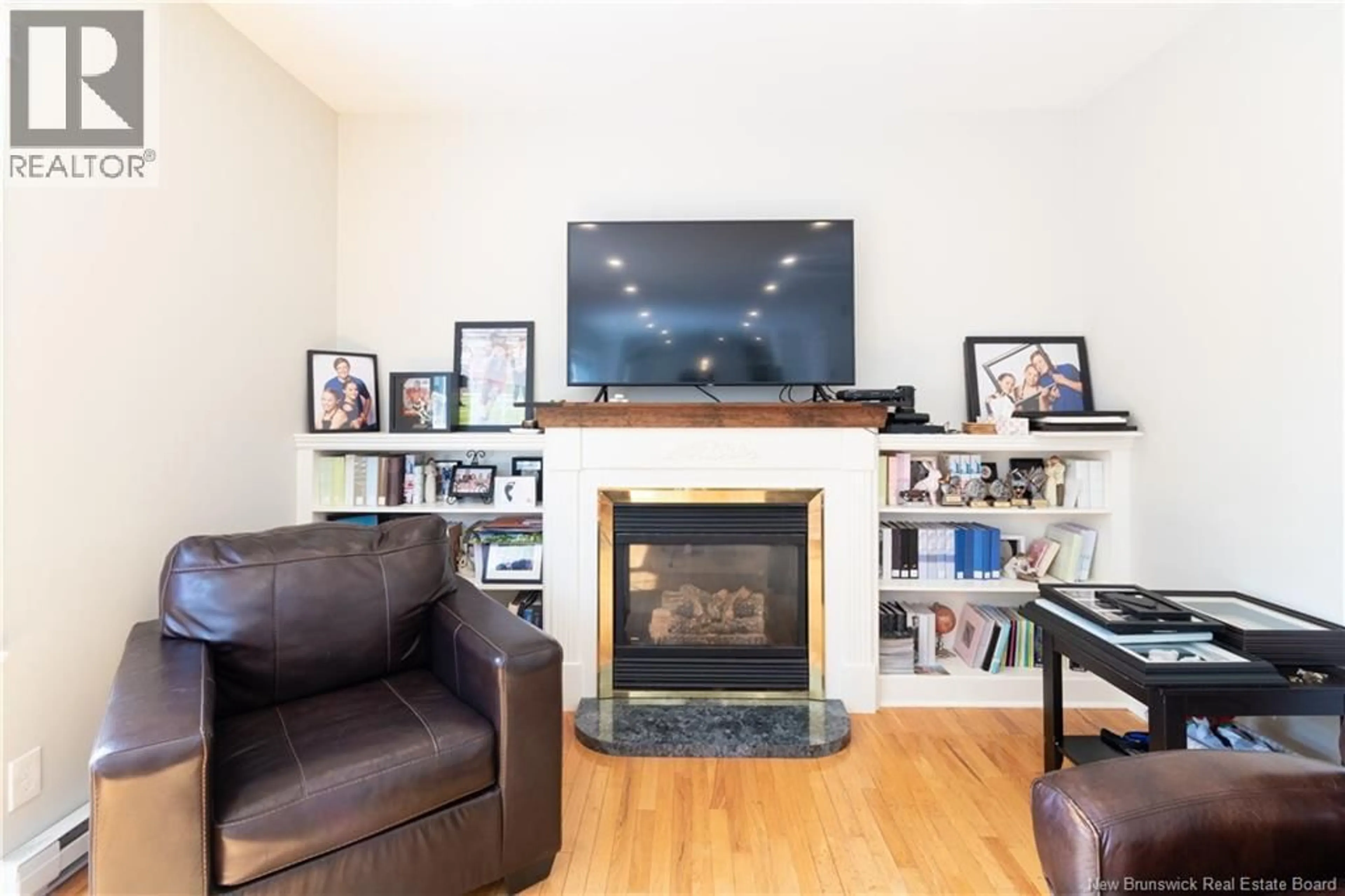 Living room with furniture, wood/laminate floor for 153 LEXINGTON LANE, Fredericton New Brunswick E3A5S7