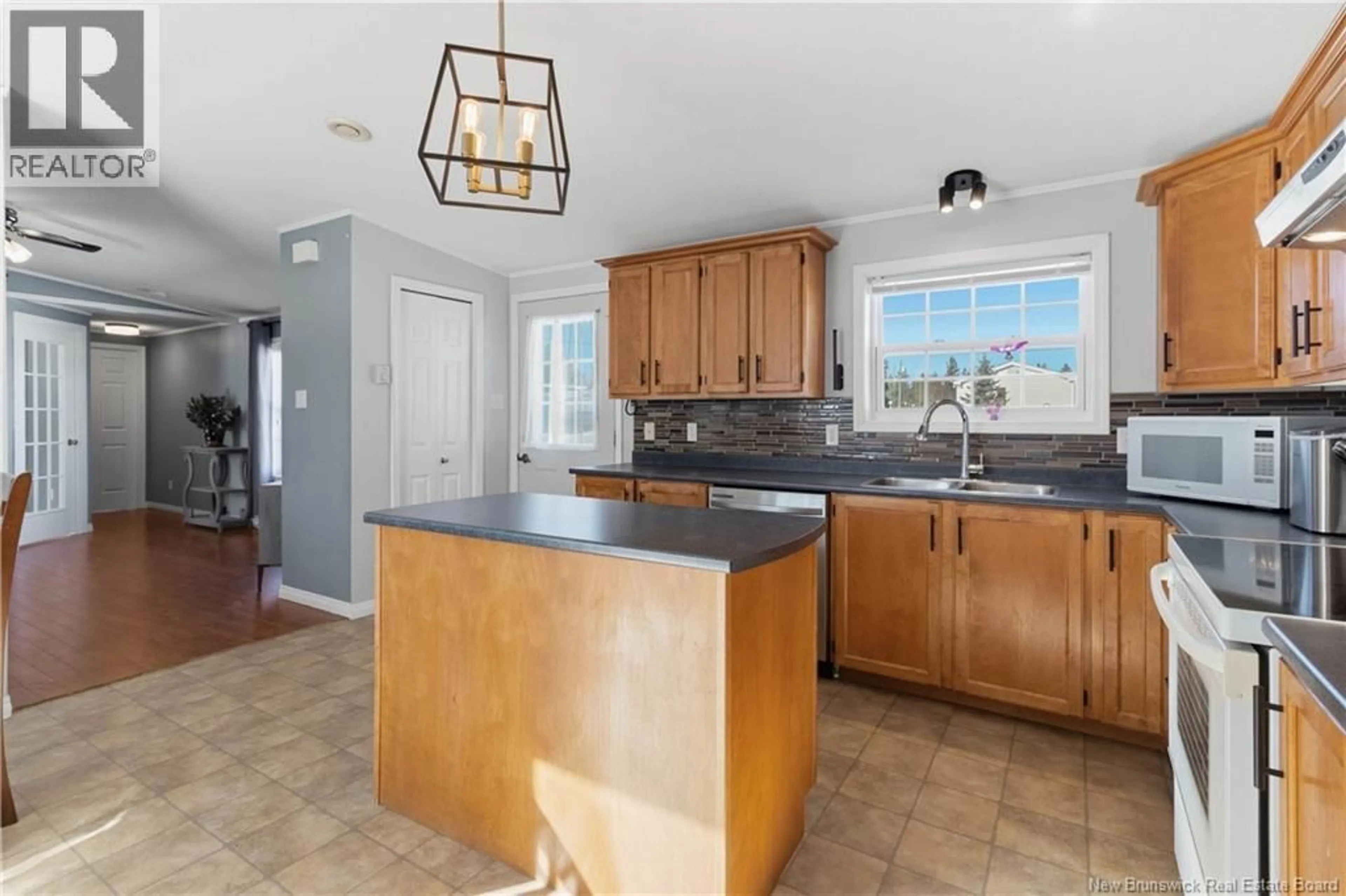 Open concept kitchen, ceramic/tile floor for 24 BLUE ASH STREET, Moncton New Brunswick E1H3R2