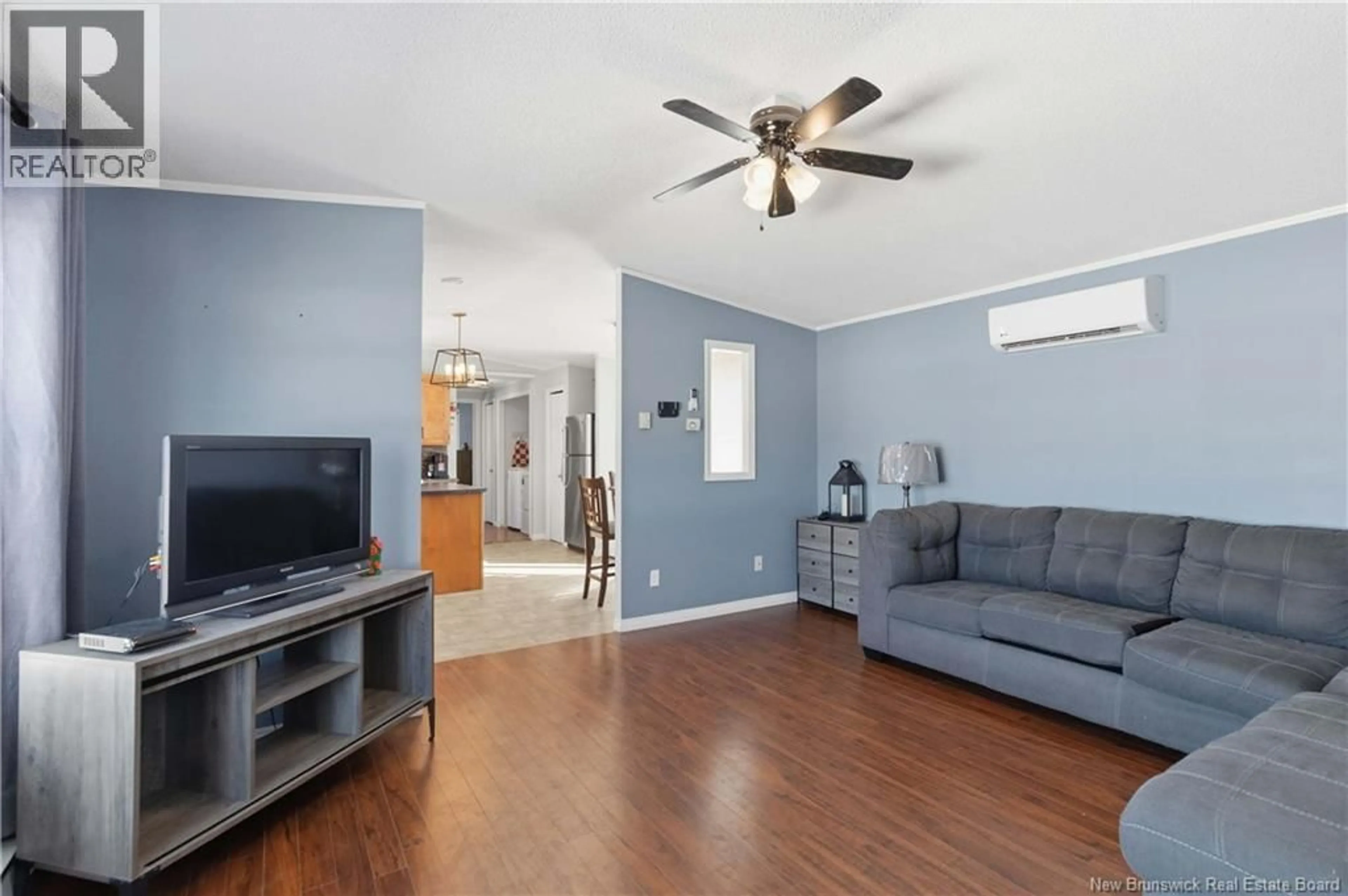 Living room with furniture, wood/laminate floor for 24 BLUE ASH STREET, Moncton New Brunswick E1H3R2