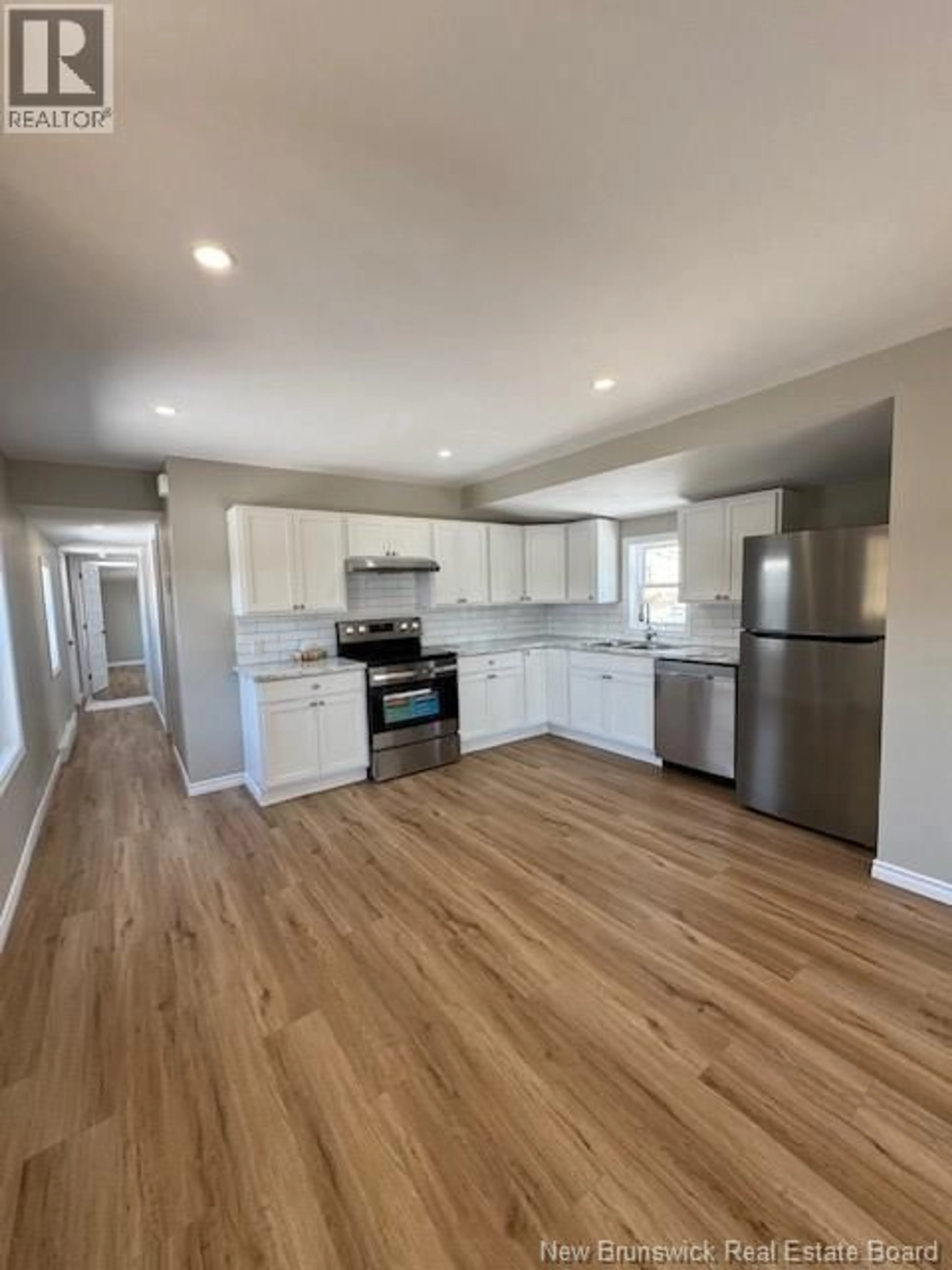 Open concept kitchen, wood/laminate floor for 239 PURDY DRIVE, Saint John New Brunswick E2H2R2