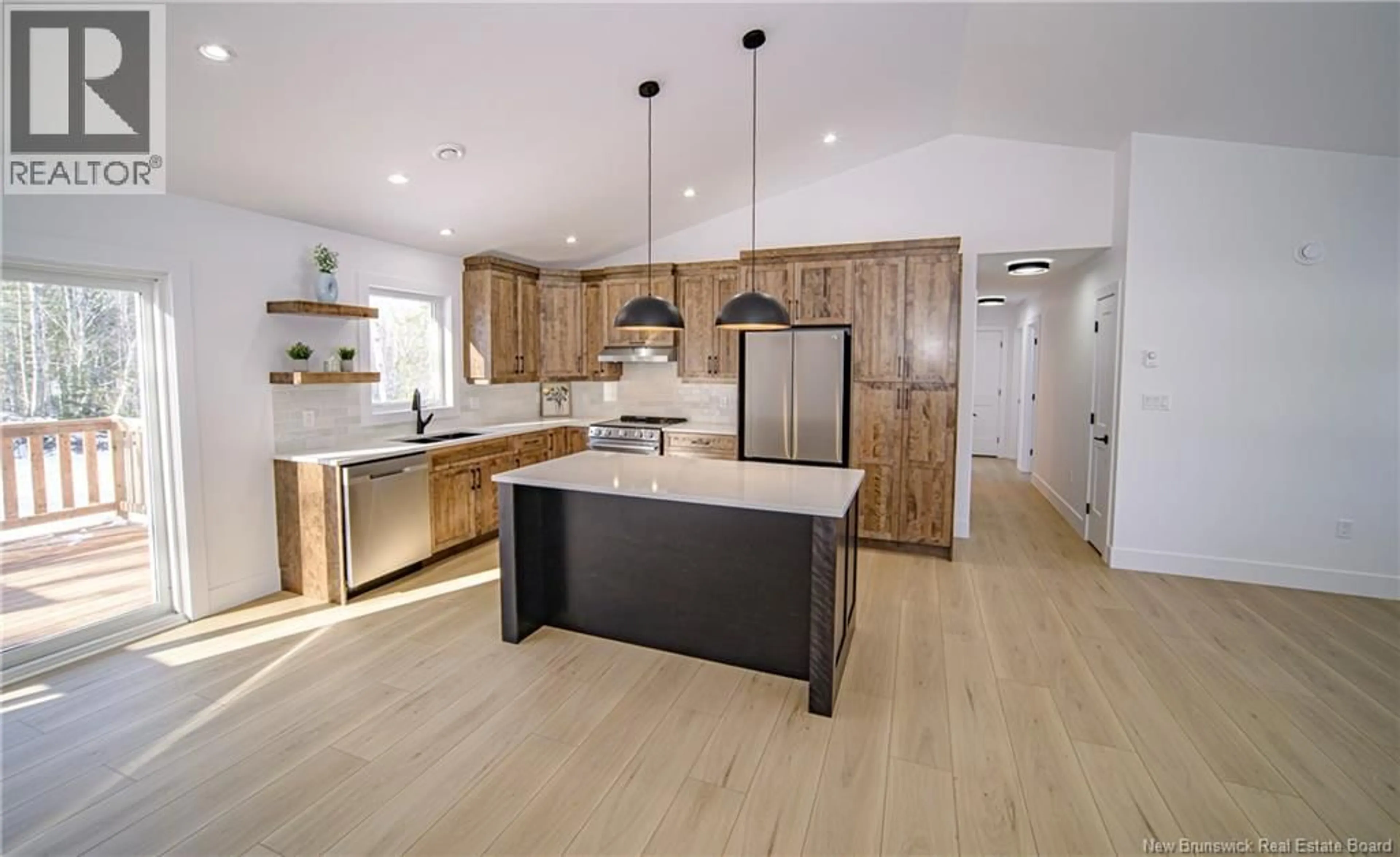 Open concept kitchen, wood/laminate floor for 34 BERRY DRIVE, Rusagonis New Brunswick E3B0V9