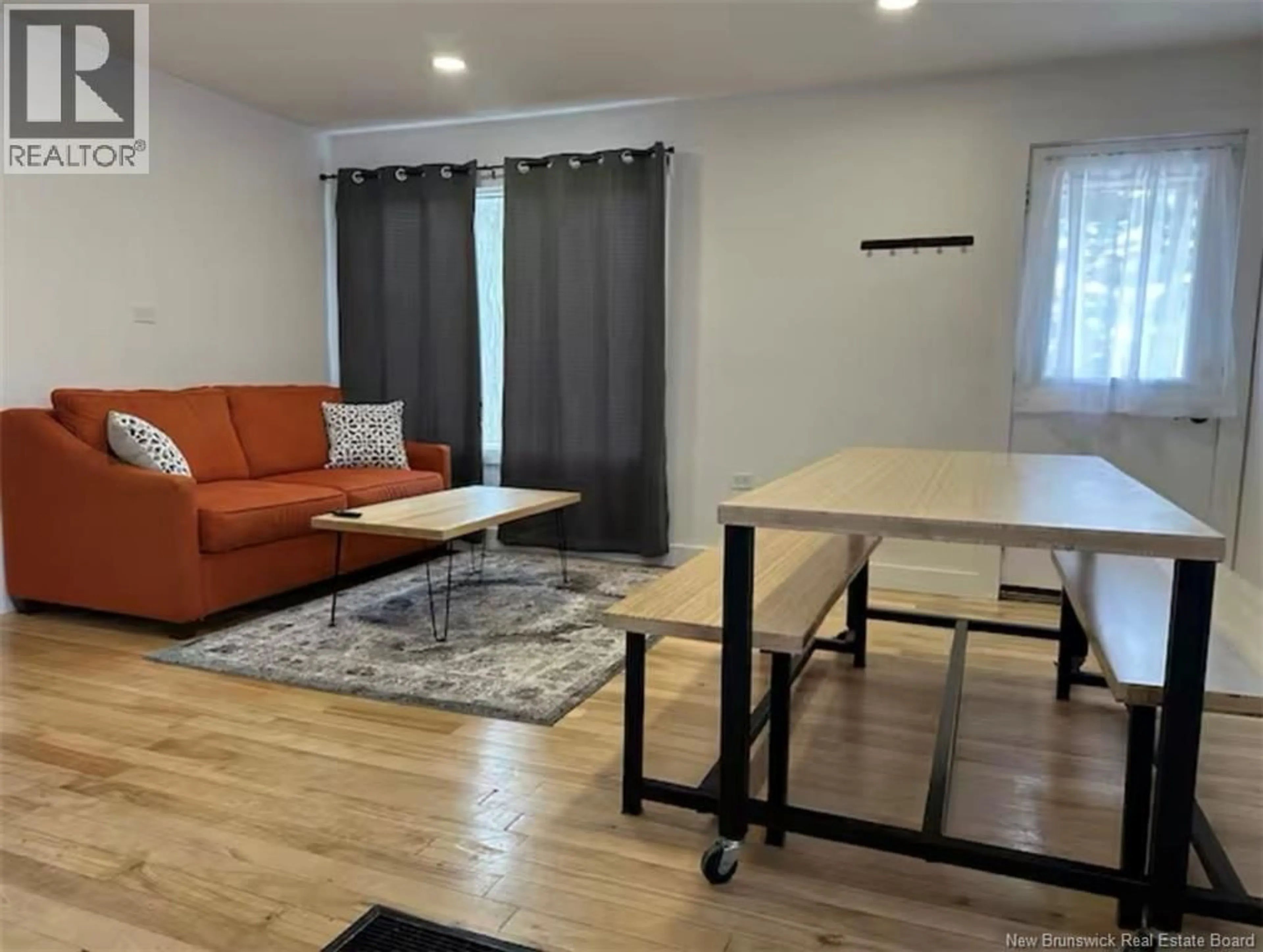 Living room with furniture, wood/laminate floor for 733 MACLAREN AVENUE, Devon New Brunswick E3A3L4