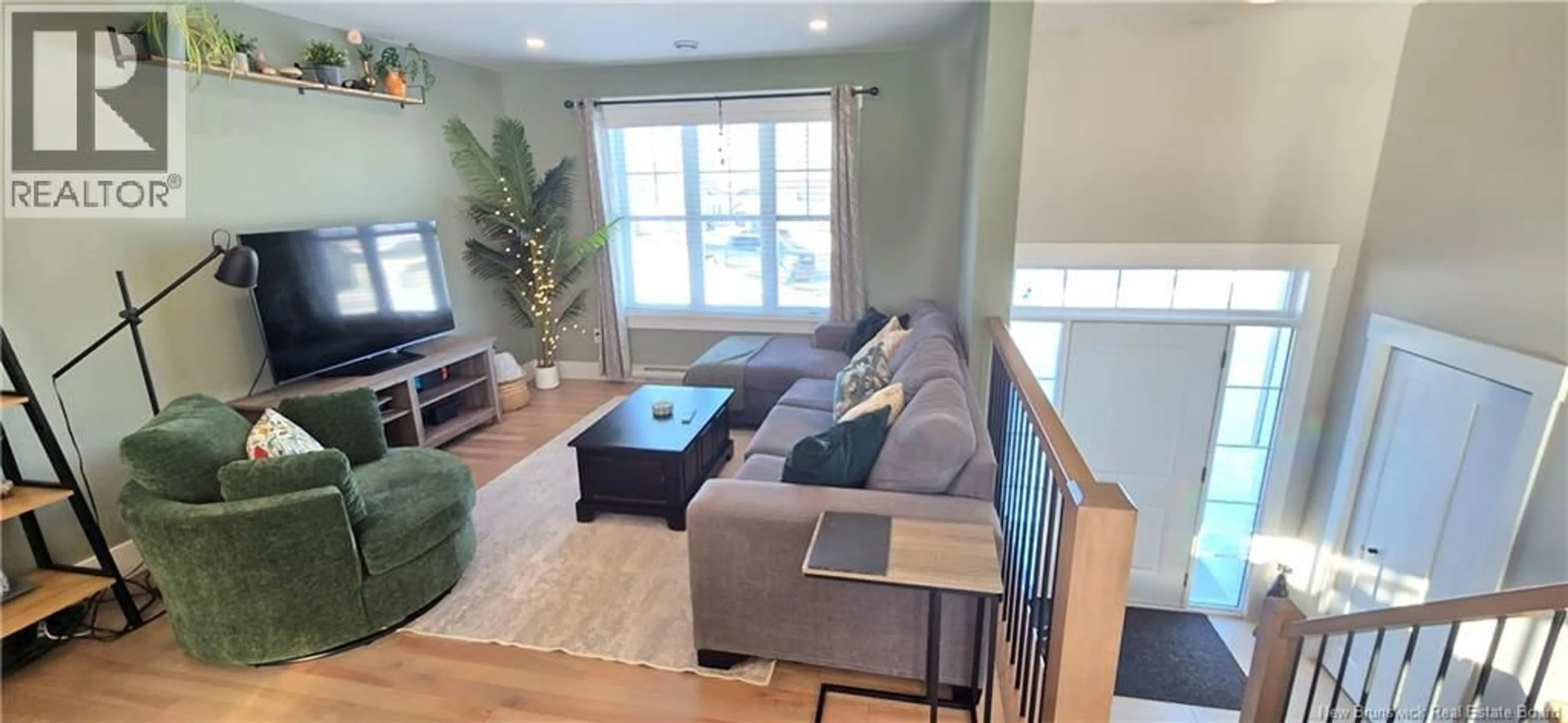 Living room with furniture, wood/laminate floor for 10 LEANDRE STREET, Memramcook New Brunswick E4K0B9