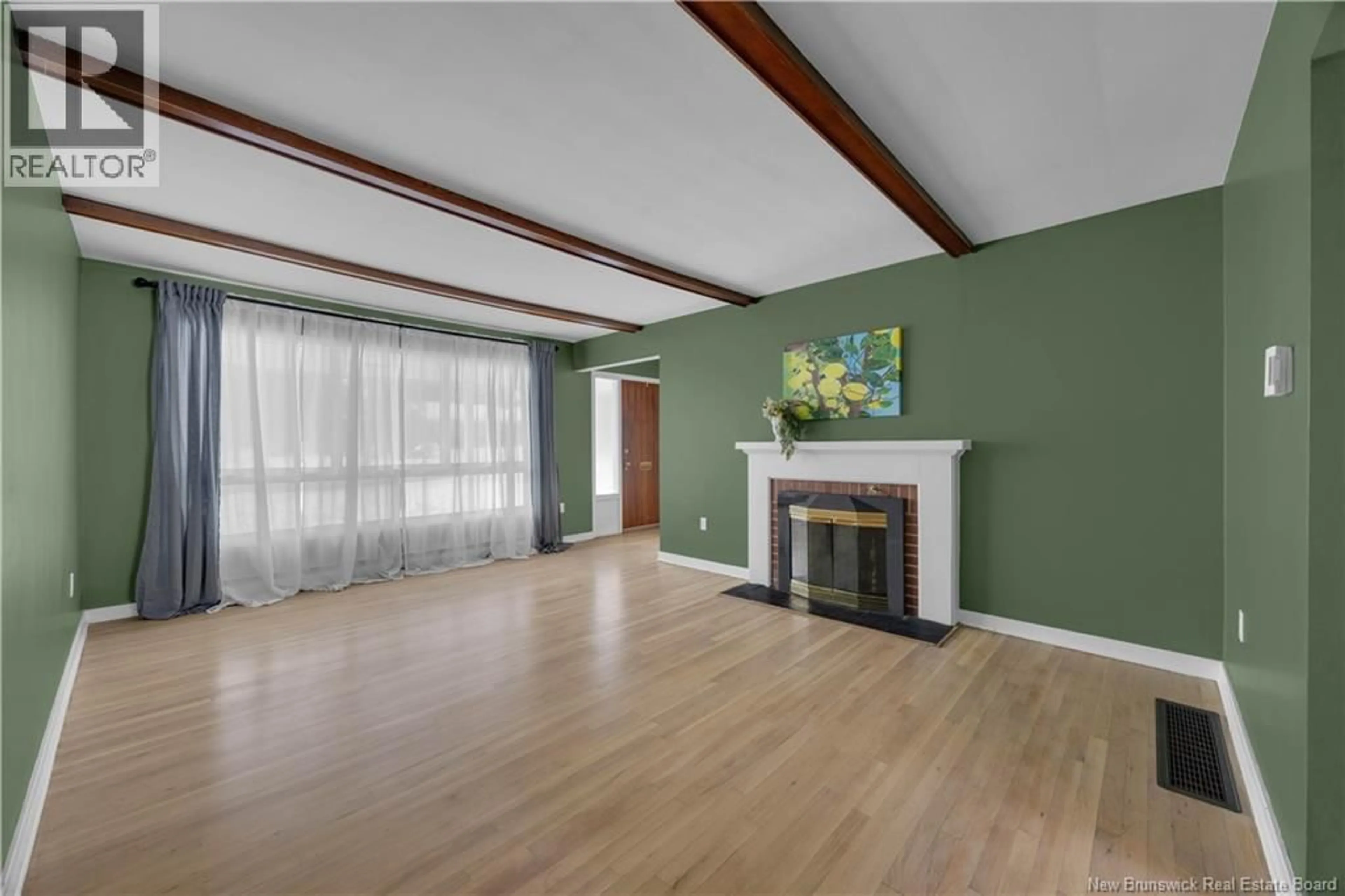 Living room with furniture, wood/laminate floor for 15 FOREST ROAD, Rothesay New Brunswick E2H1B4