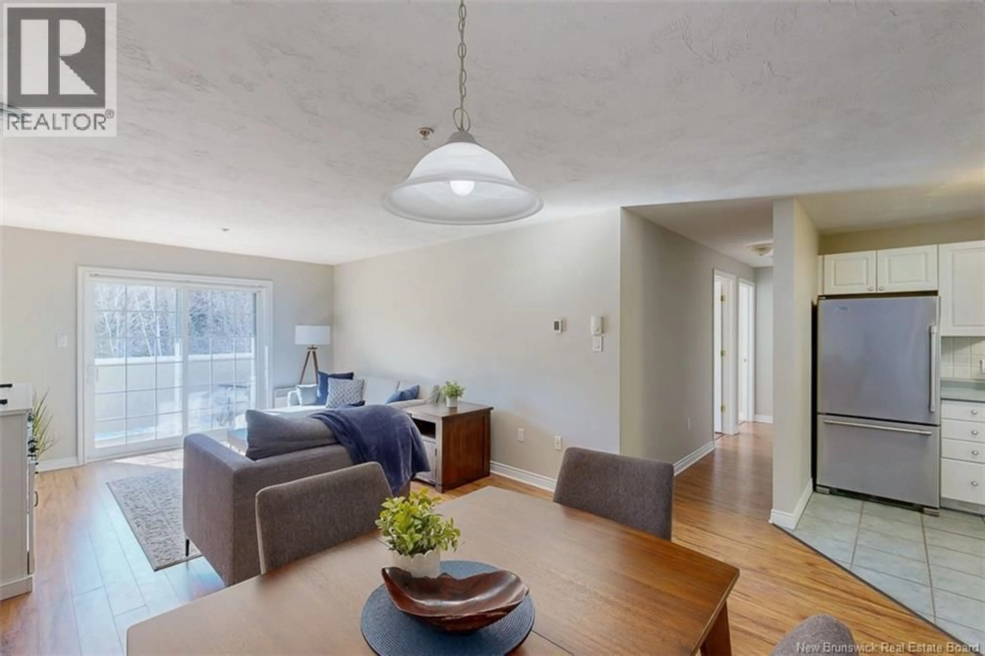 Living room with furniture, wood/laminate floor for 410 - 158 HANWELL ROAD, Fredericton New Brunswick E3B9K7