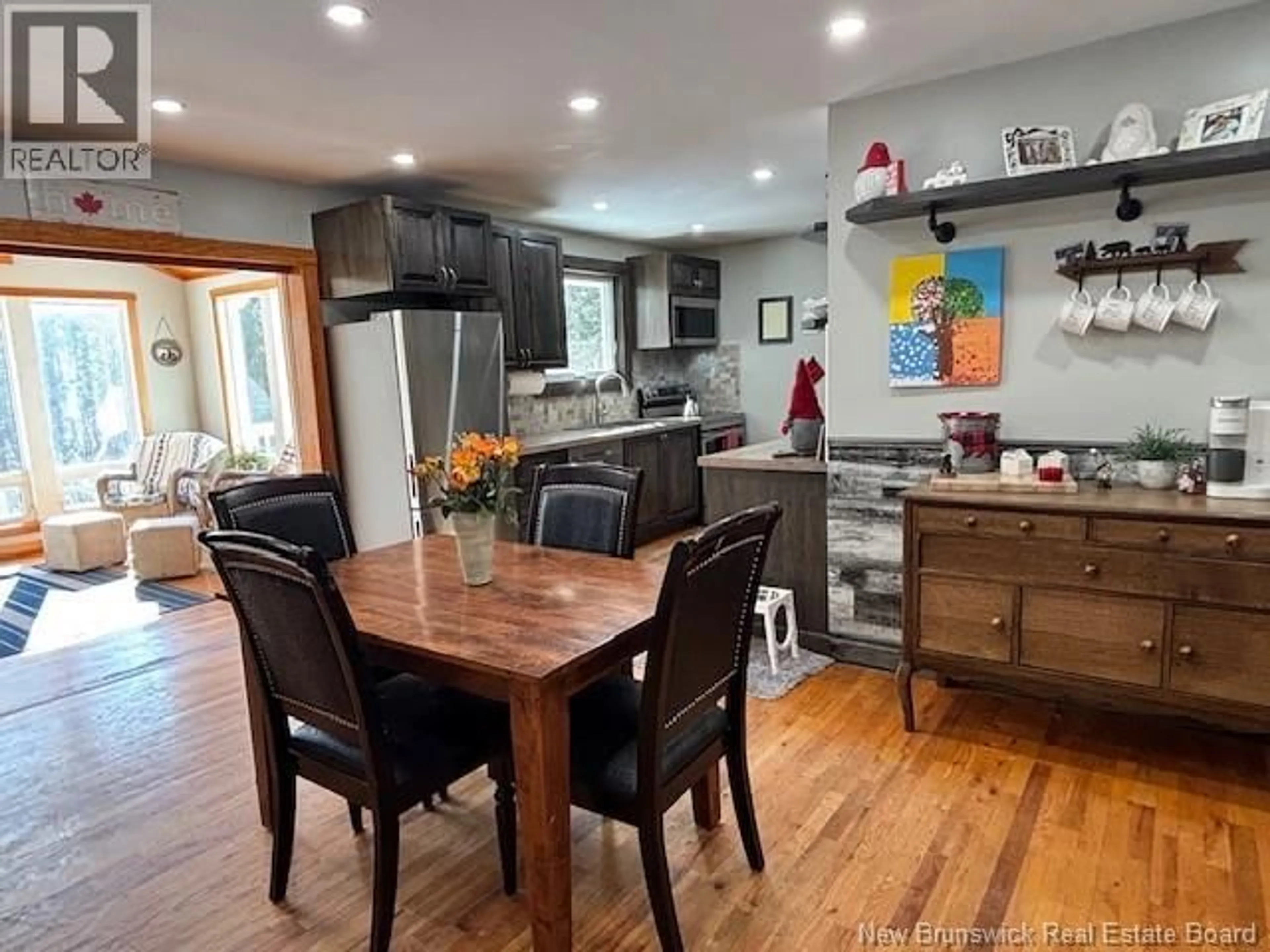 Open concept kitchen, wood/laminate floor for 252 DARLINGS ISLAND ROAD, Darlings Island New Brunswick E5N6S3