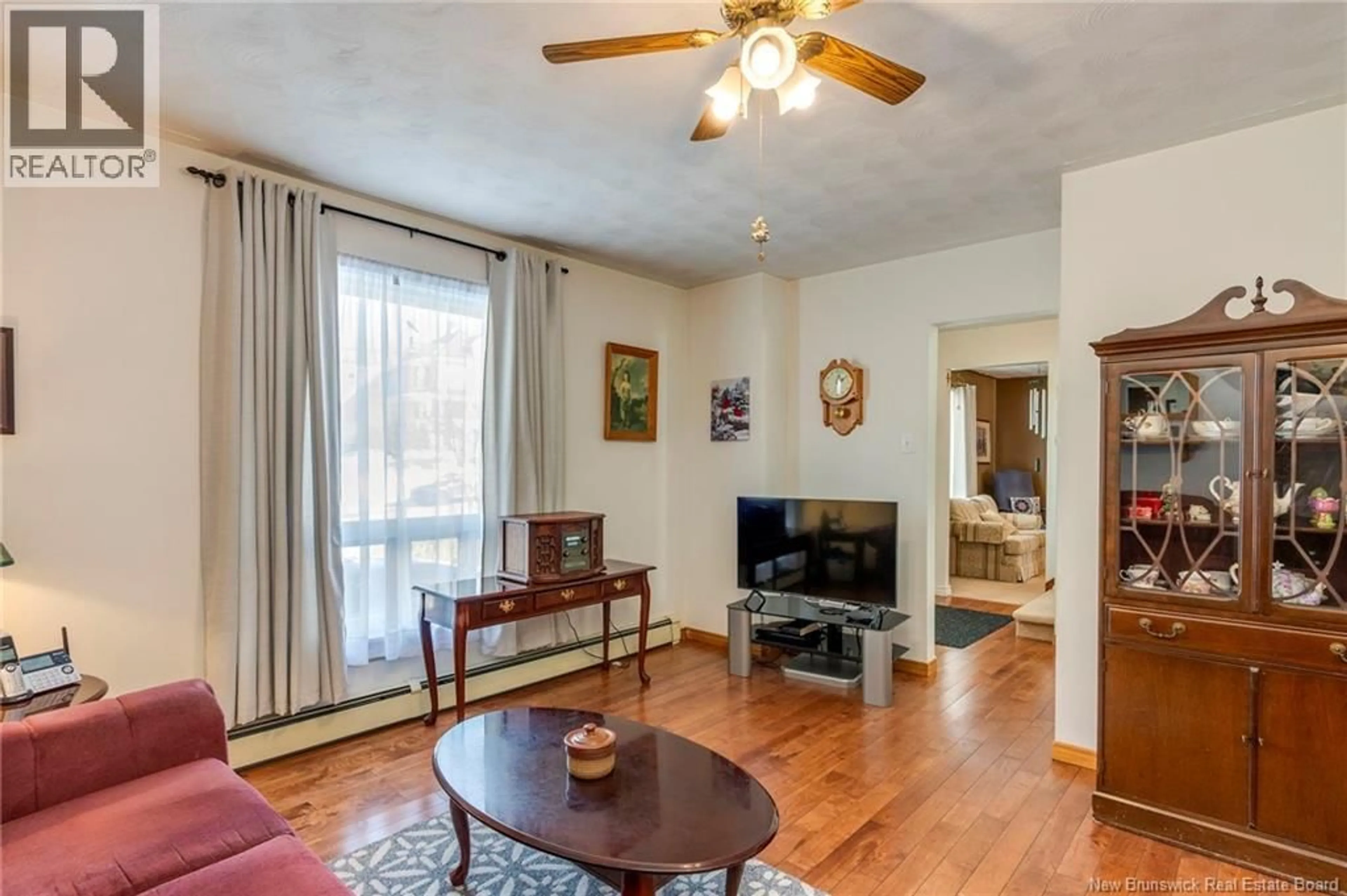 Living room with furniture, wood/laminate floor for 44 BELGRAVE STREET, Saint John New Brunswick E2J1C8