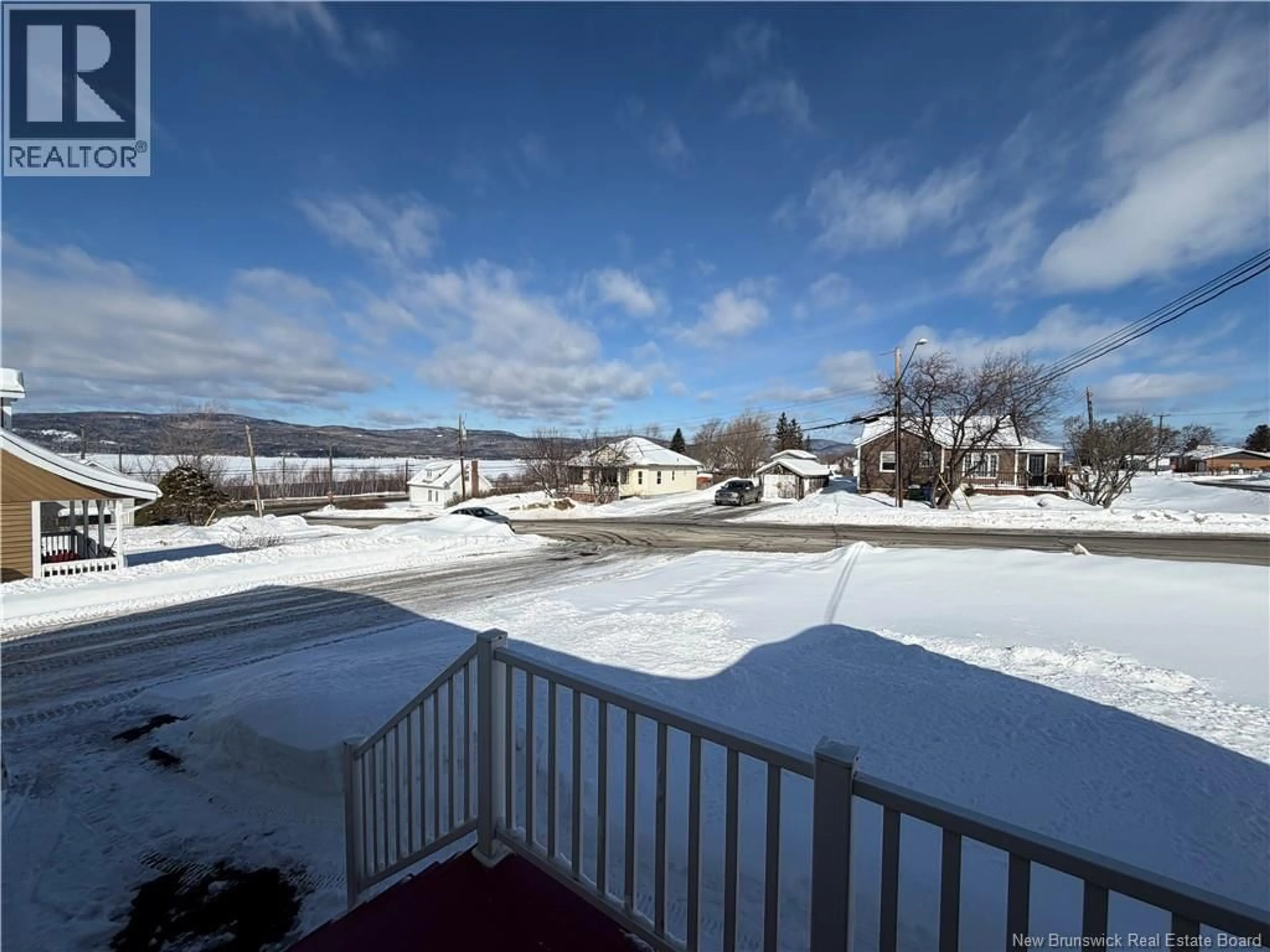 A pic from outside/outdoor area/front of a property/back of a property/a pic from drone, water/lake/river/ocean view for 50 D'ANJAC STREET, Atholville New Brunswick E3N3V9