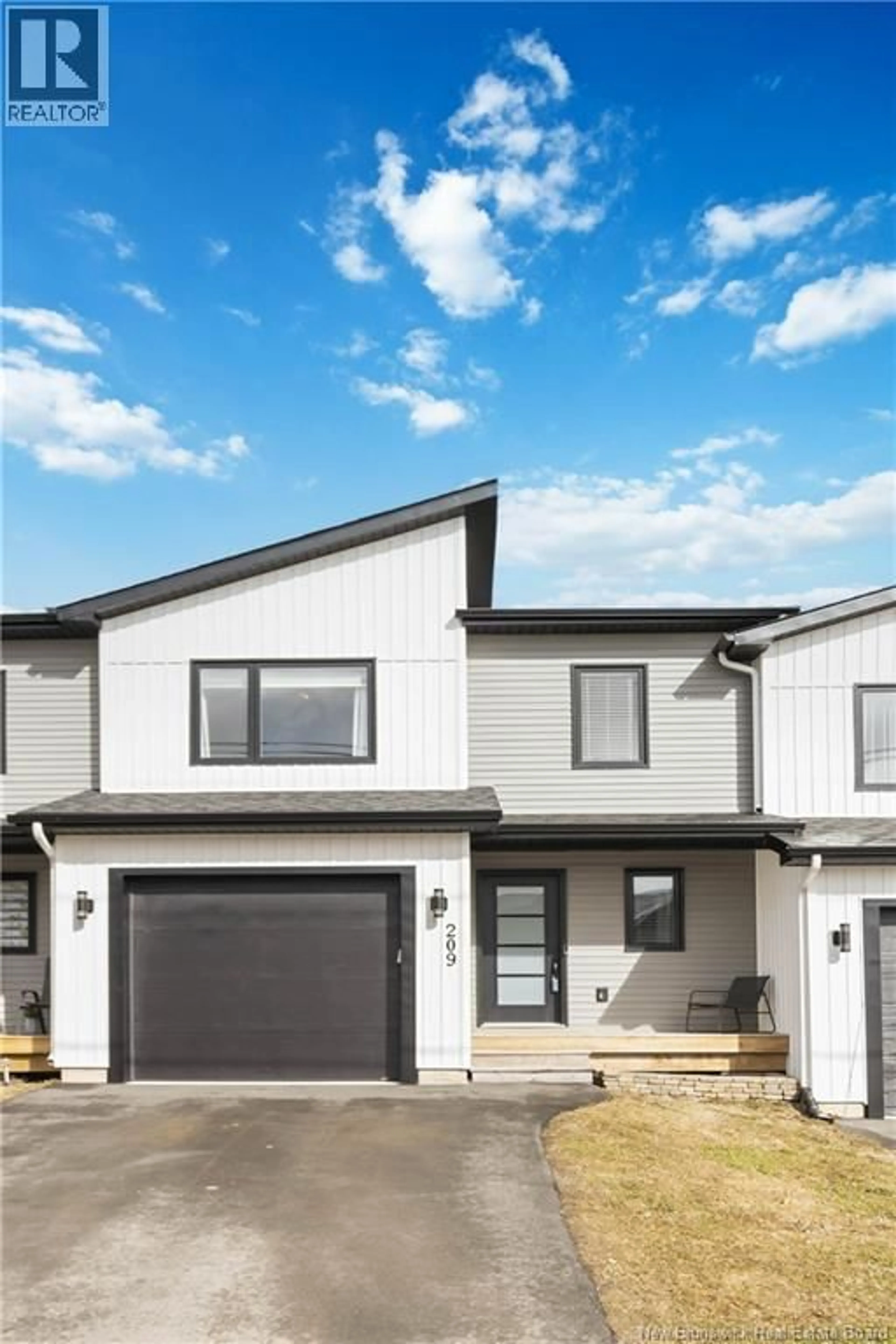 Home with vinyl exterior material, street for 209 NORBERT, Dieppe New Brunswick E1A9Y9