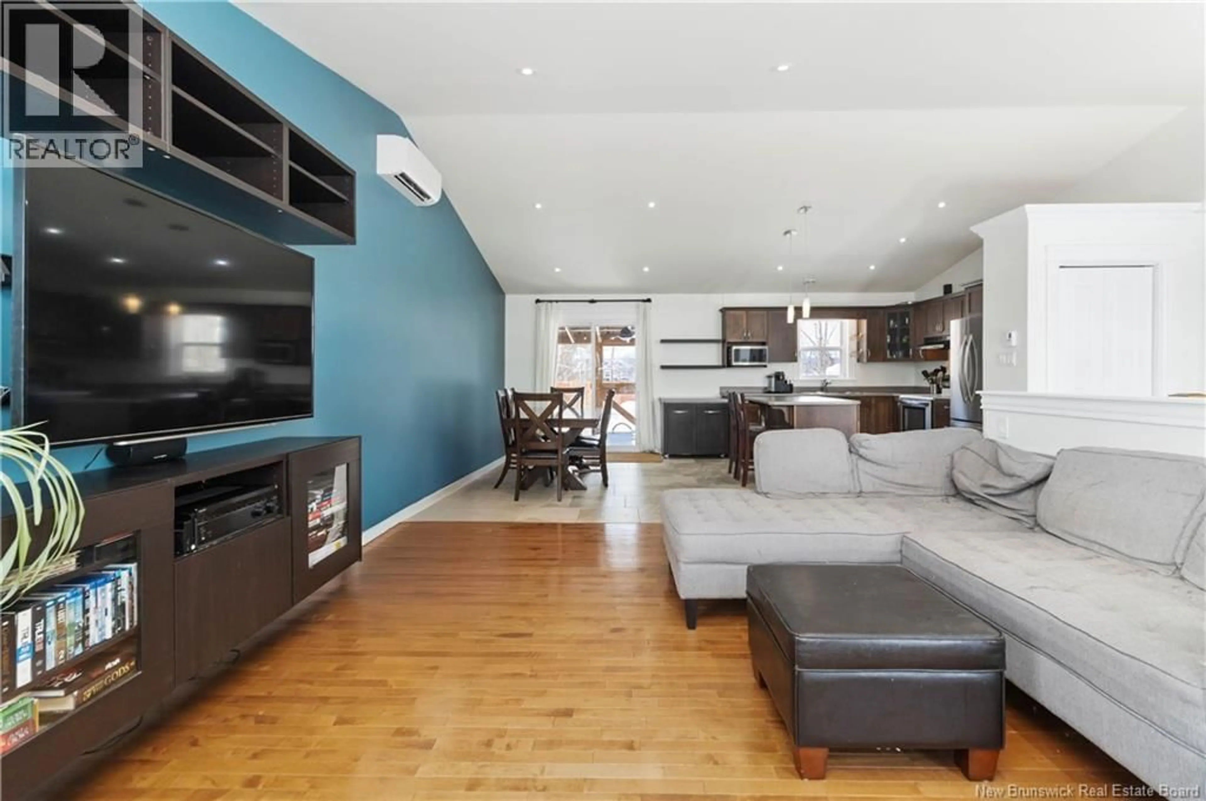 Living room with furniture, wood/laminate floor for 18 MCCOY, Moncton New Brunswick E1G0K6