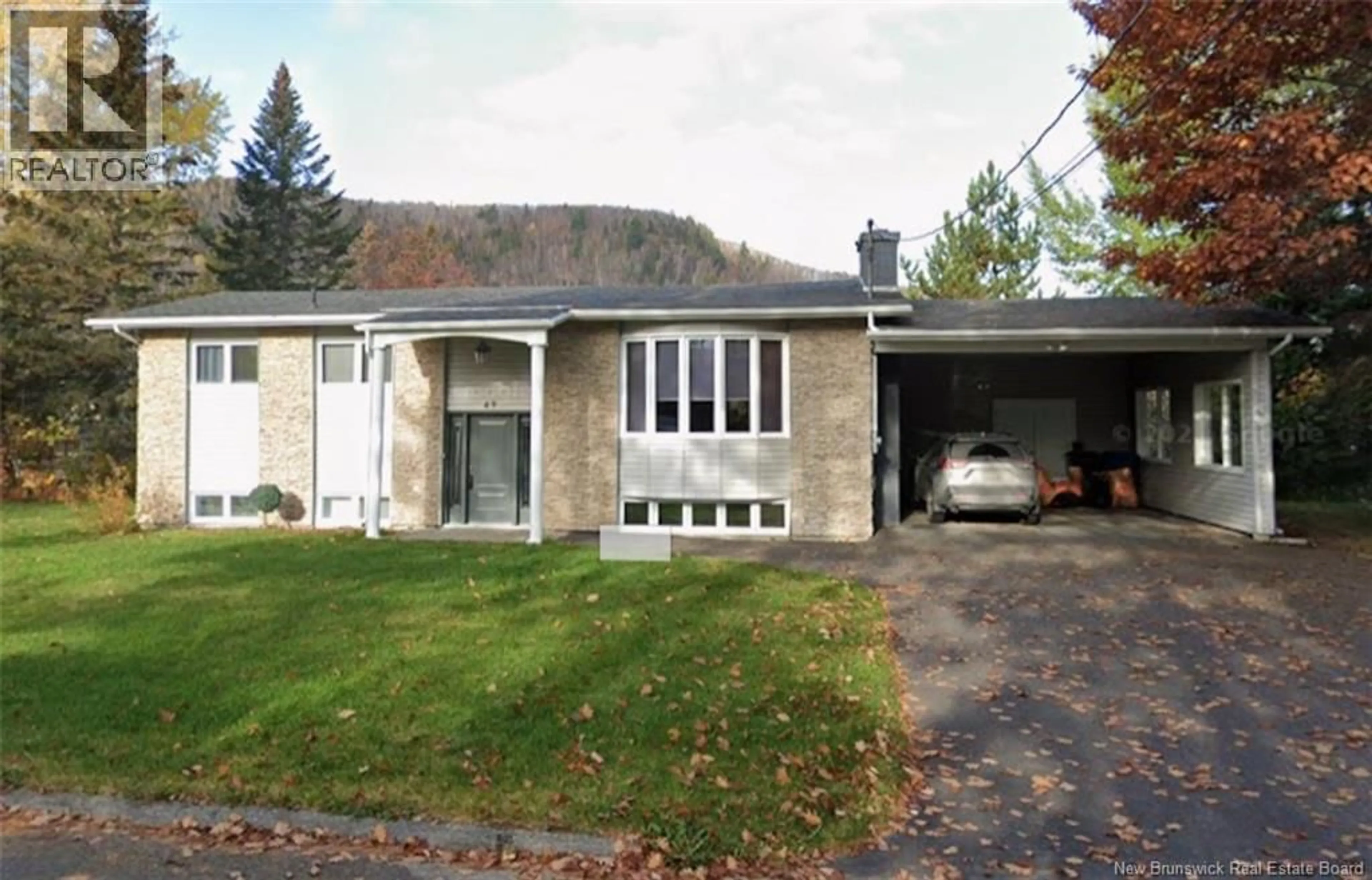 Home with vinyl exterior material, street for 49 HUBERT STREET, Edmundston New Brunswick E3V4K6