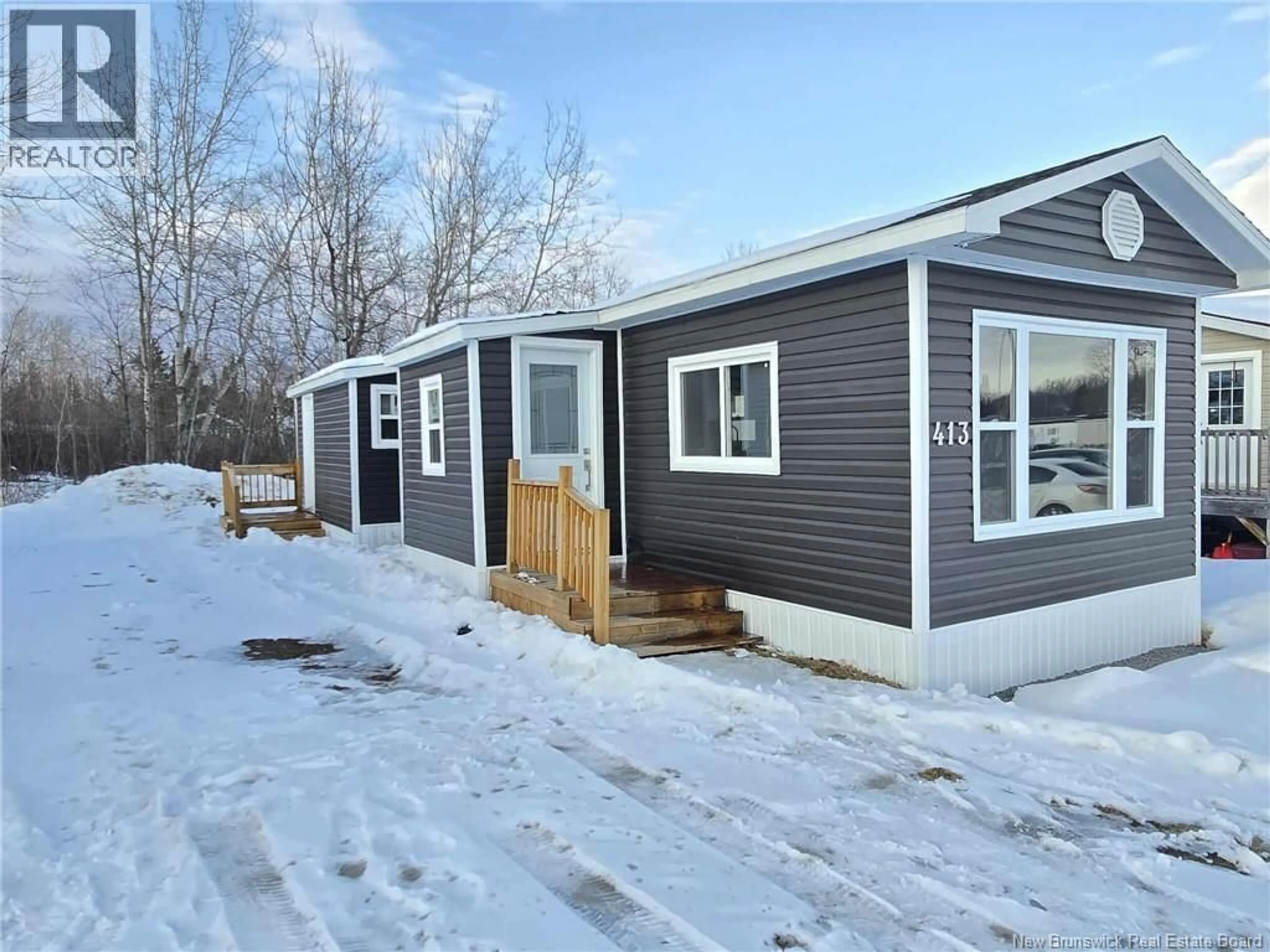 Home with vinyl exterior material, street for 413 BIRCH, Beresford New Brunswick E8K1E1