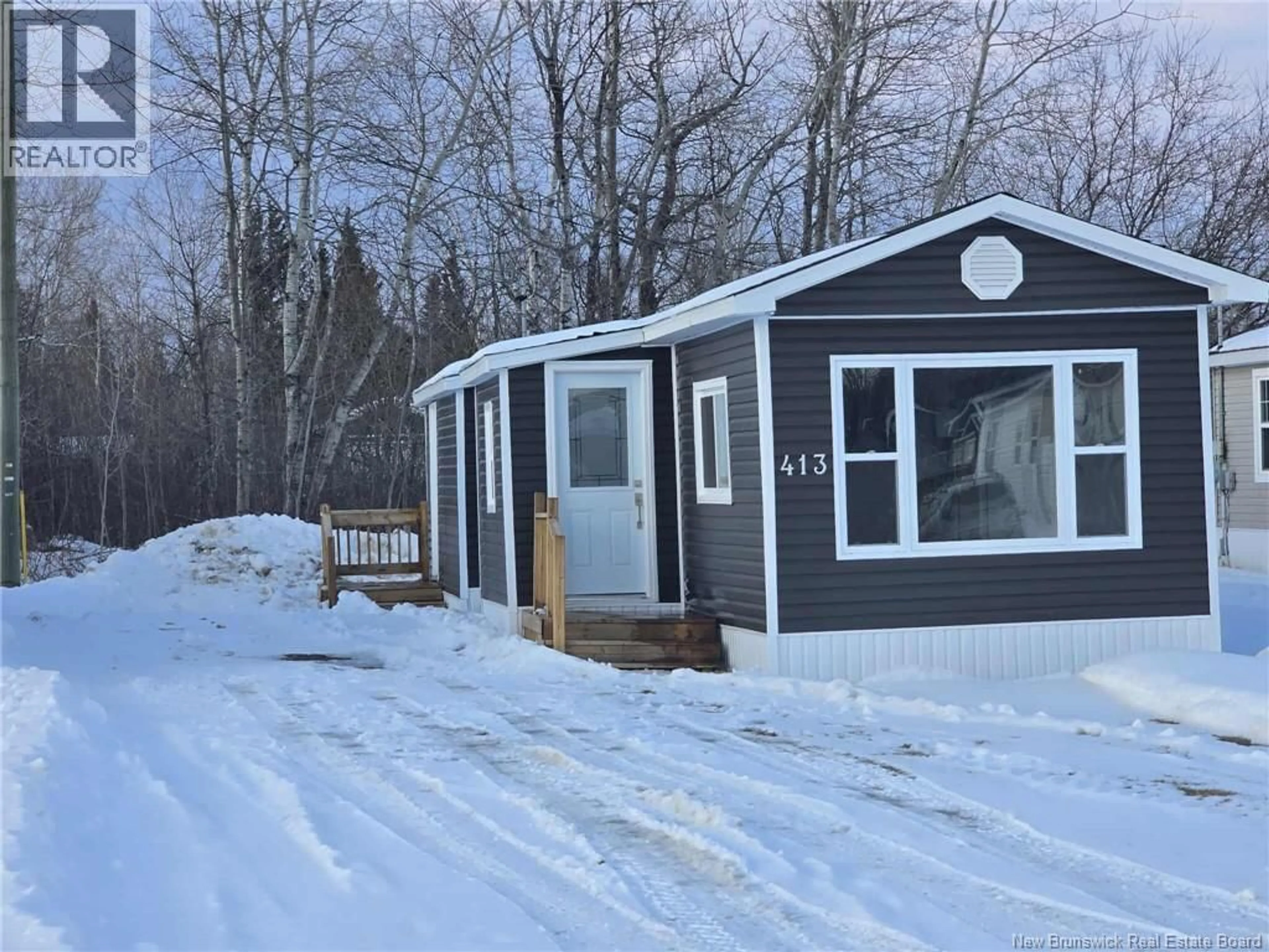 Home with vinyl exterior material, street for 413 BIRCH, Beresford New Brunswick E8K1E1