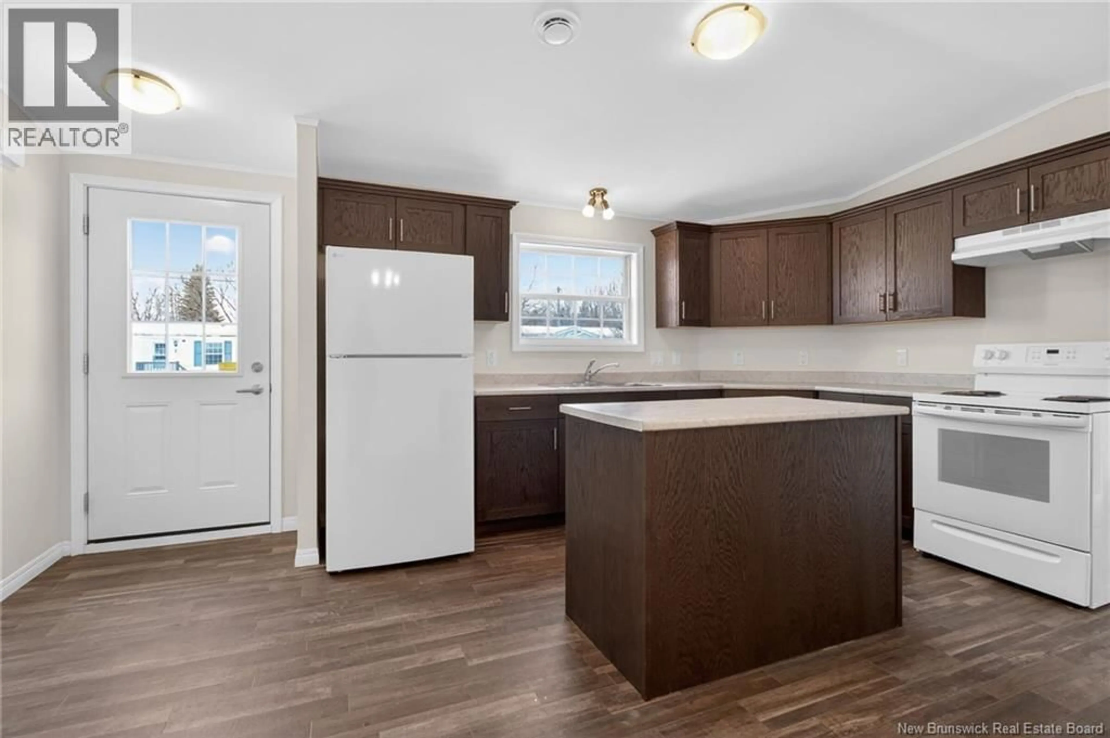 Open concept kitchen, wood/laminate floor for 8 CHICKADEE STREET, Moncton New Brunswick E1H2V4