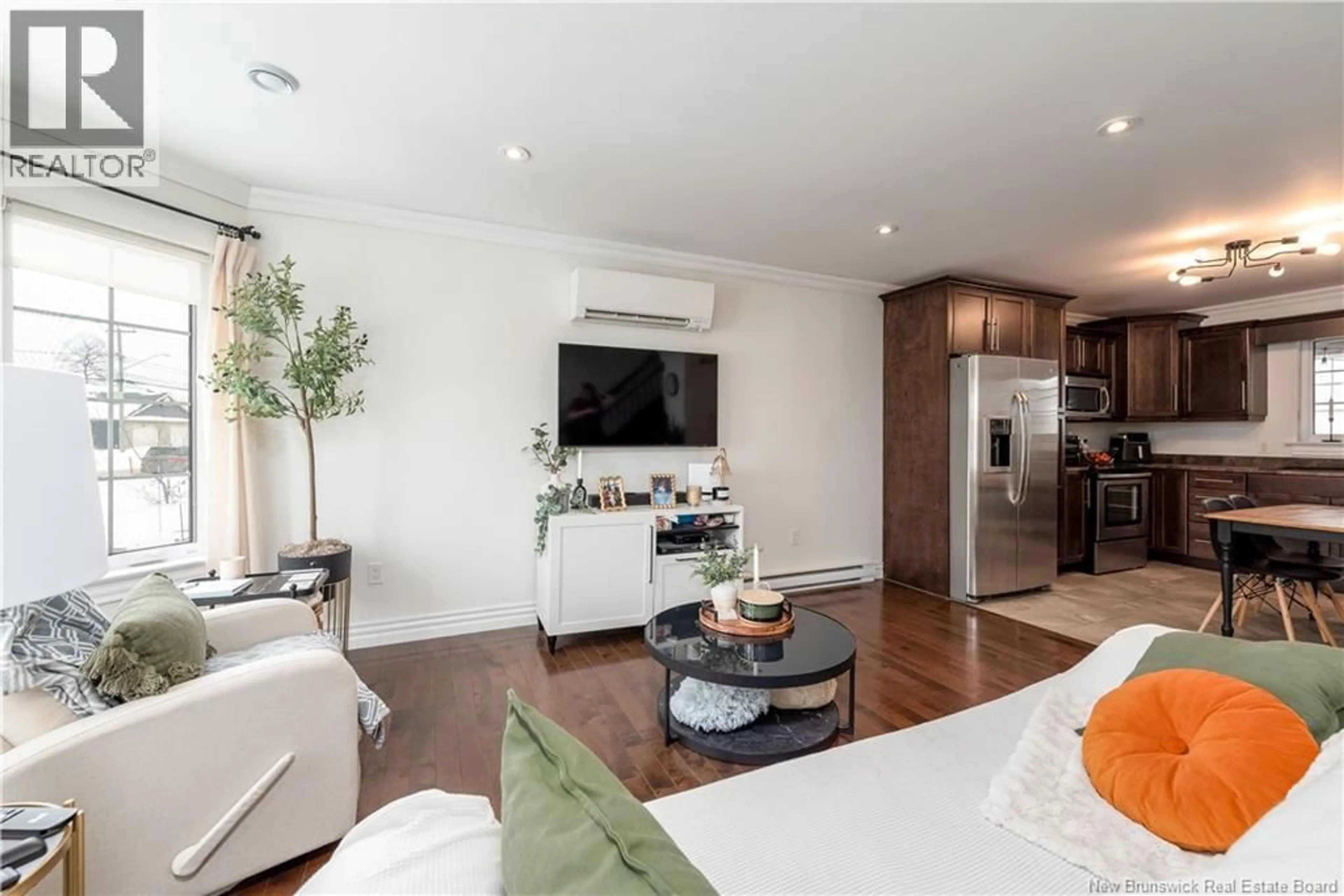 Living room with furniture, wood/laminate floor for 73 LAKEBURN AVENUE, Dieppe New Brunswick E1A0Y8