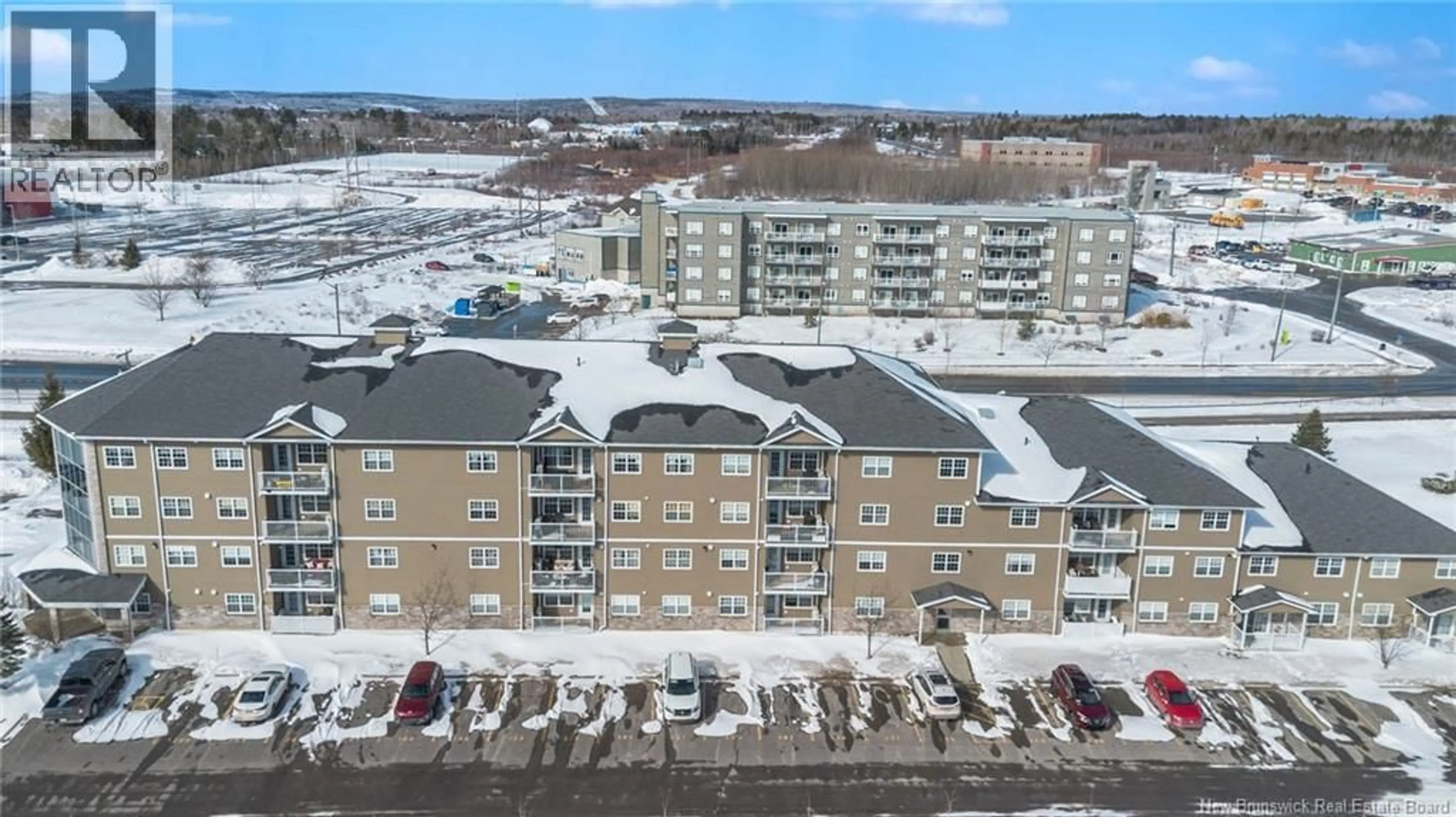 A pic from outside/outdoor area/front of a property/back of a property/a pic from drone, unknown for 107 - 700 CLIFFE, Fredericton New Brunswick E3A5V2
