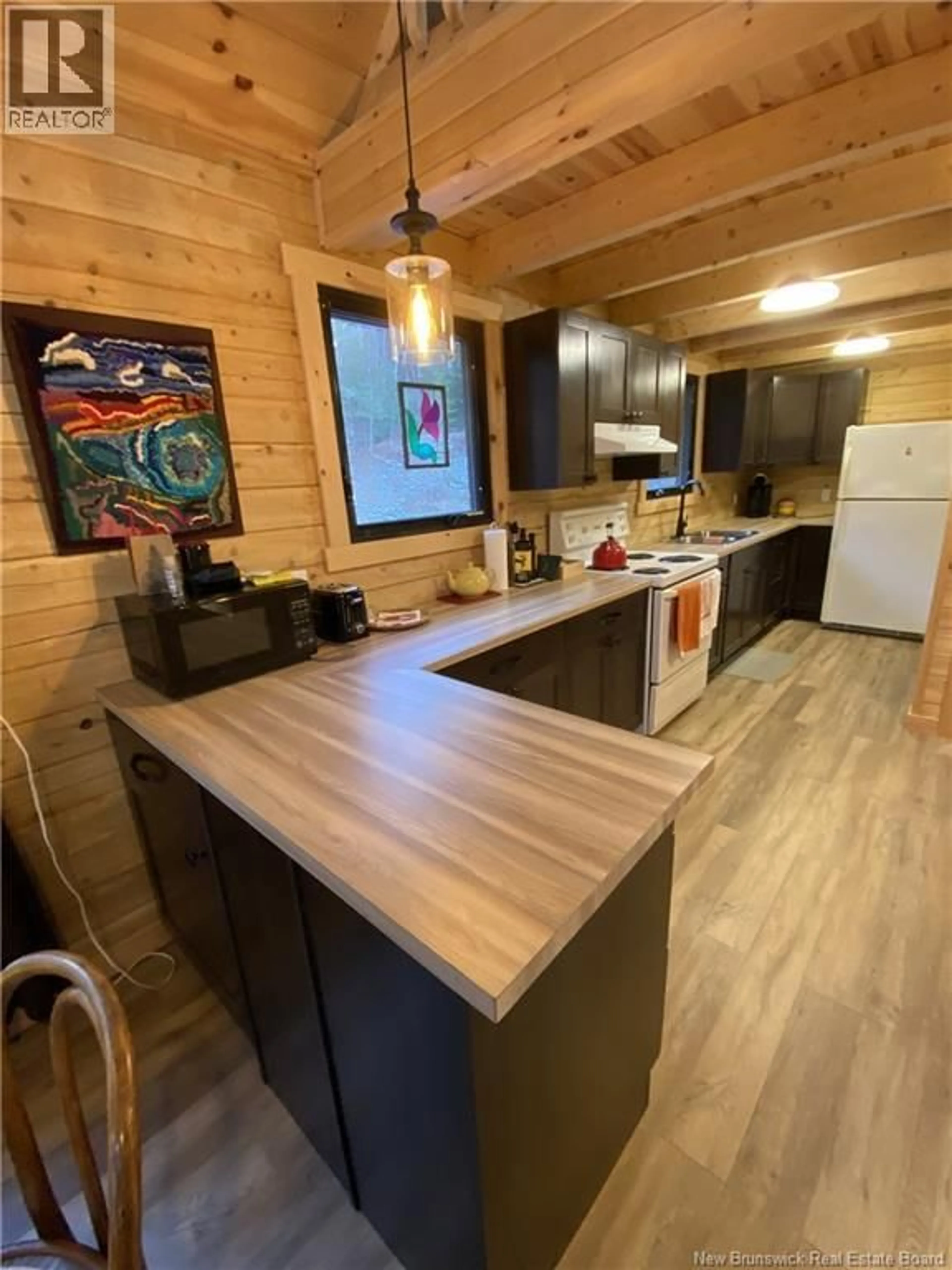 Open concept kitchen, wood/laminate floor for 124 CHAMCOOK LAKE ROAD, Chamcook New Brunswick E5B3B5