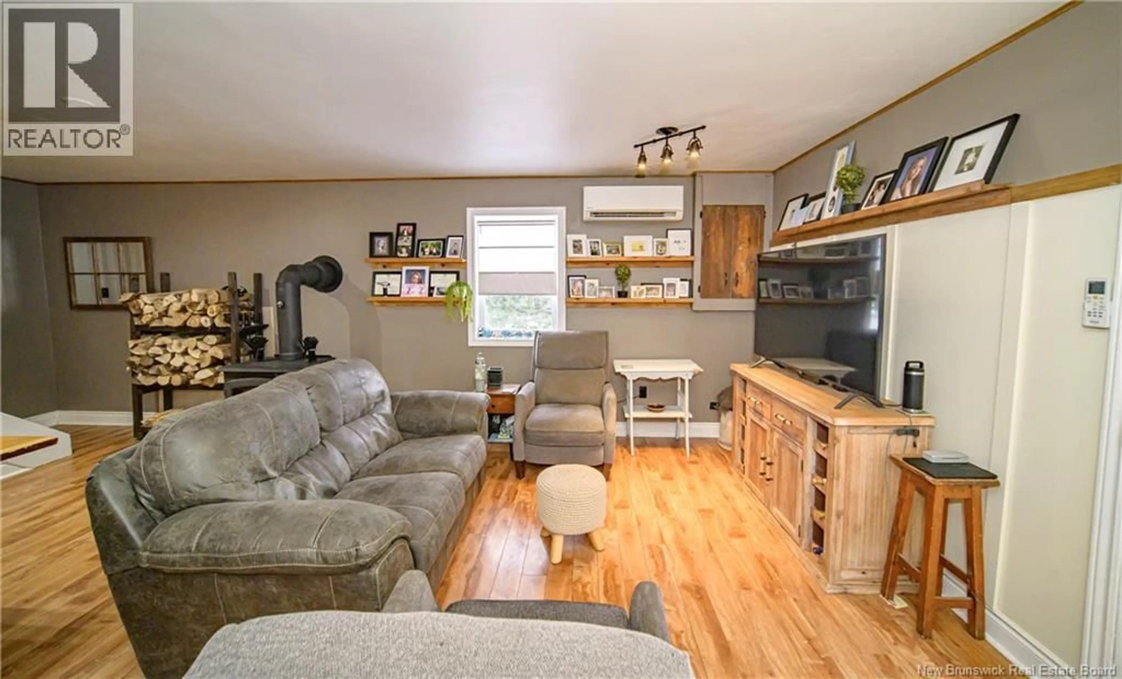 Living room with furniture, wood/laminate floor for 156 MEADOW LANE, Jemseg New Brunswick E3C3Z3