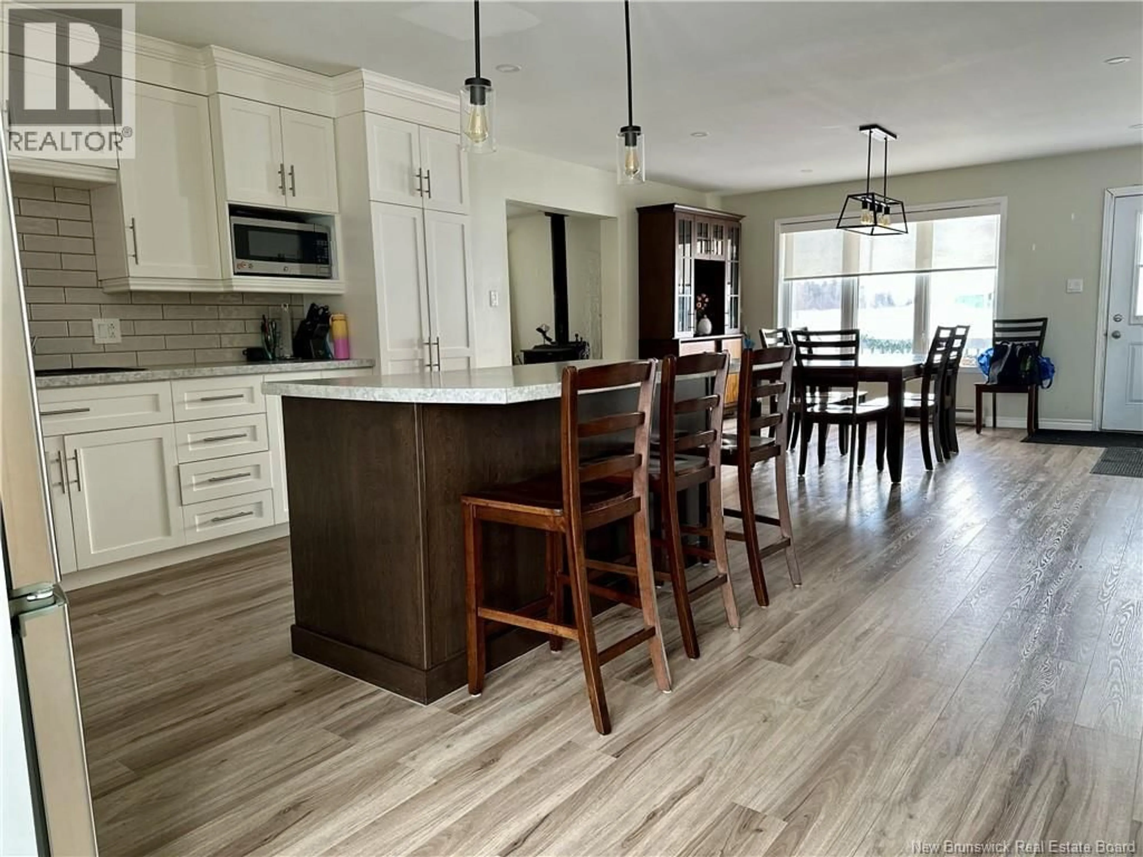 Open concept kitchen, wood/laminate floor for 45 L'ANSE STREET, Eel River Crossing New Brunswick E8E1P9