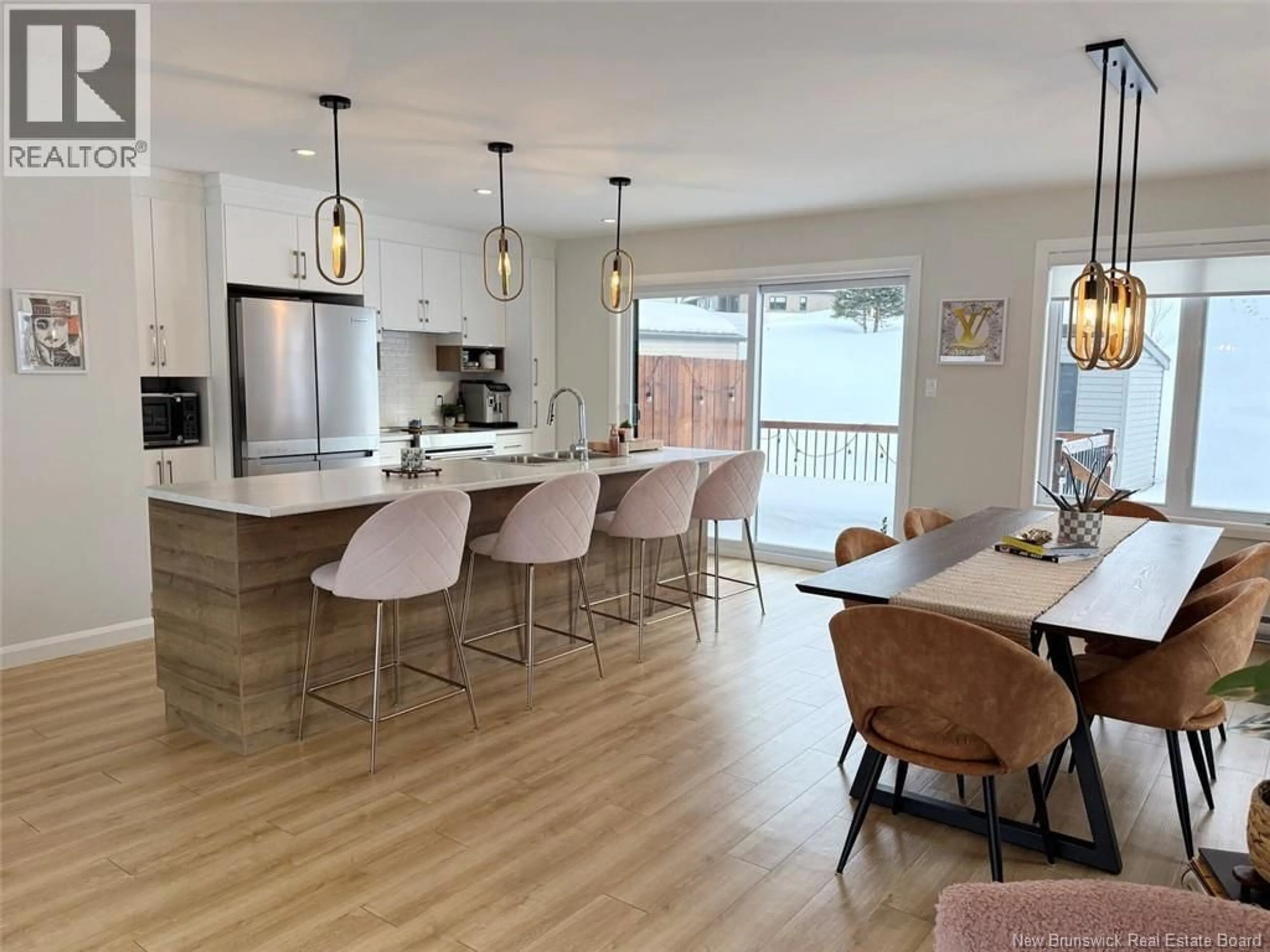 Open concept kitchen, wood/laminate floor for 44 VOLPÉ STREET, Edmundston New Brunswick E3V4A1