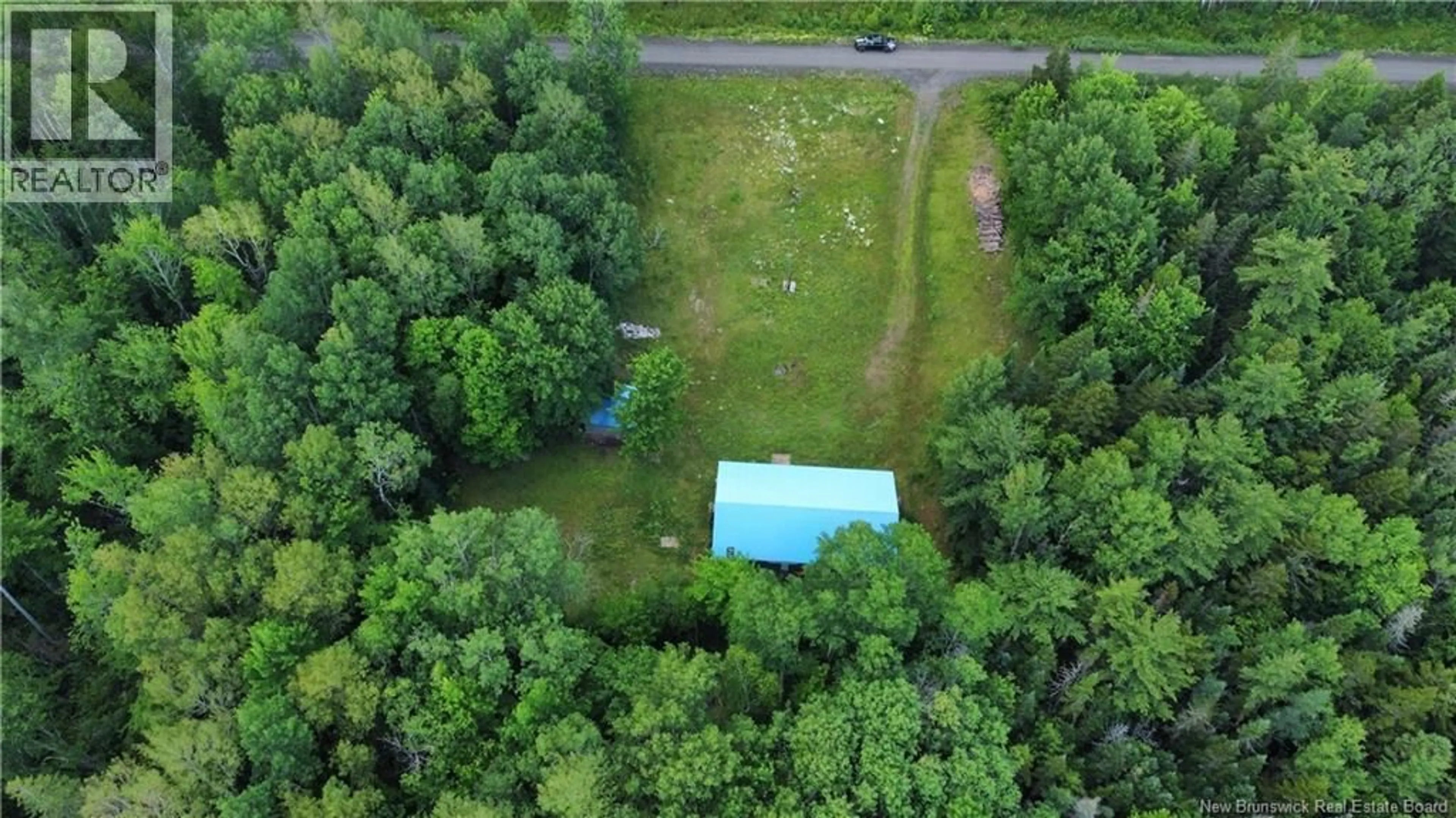 A pic from outside/outdoor area/front of a property/back of a property/a pic from drone, forest/trees view for 534 CORMIER VILLAGE BYE ROAD, Cocagne New Brunswick E4R3B6