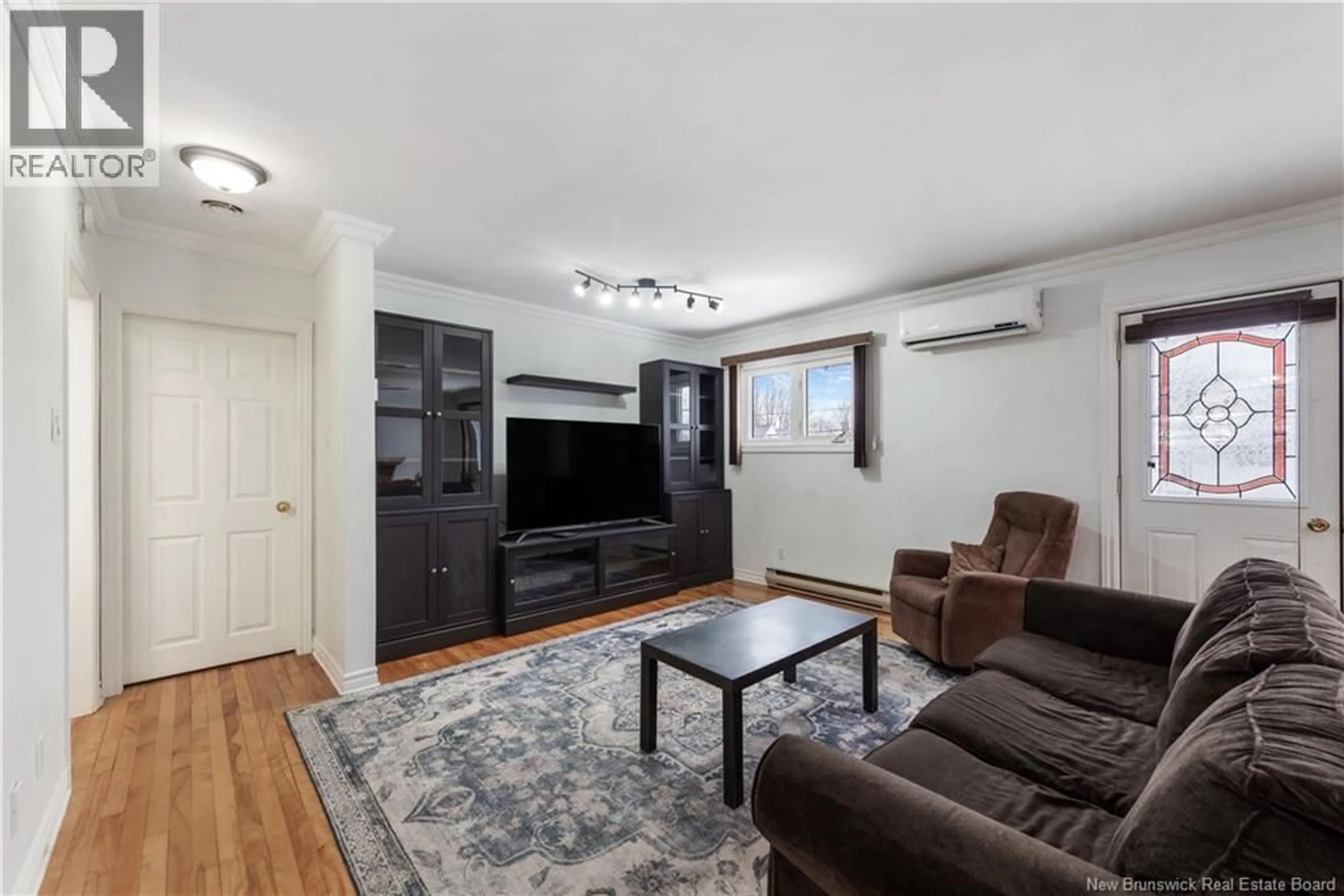 Living room with furniture, wood/laminate floor for 188 SECOND AVENUE, Moncton New Brunswick E1C7Y6