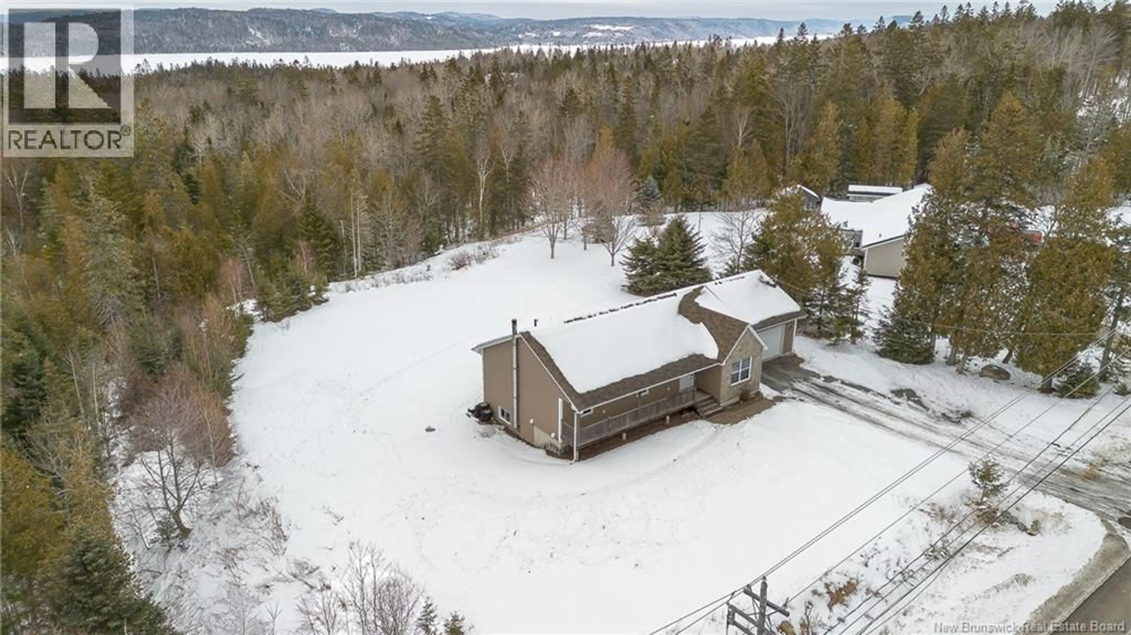 A pic from outside/outdoor area/front of a property/back of a property/a pic from drone, unknown for 95 MEENANS COVE ROAD, Quispamsis New Brunswick E2G1Y8