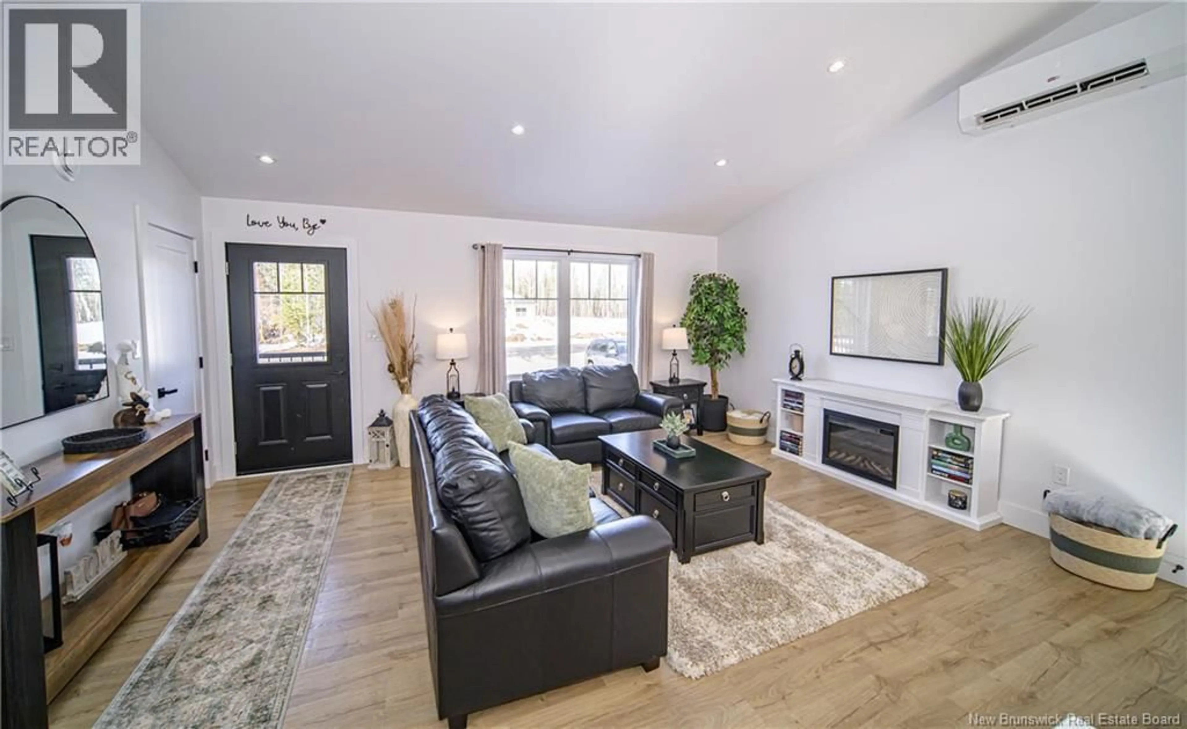 Living room with furniture, wood/laminate floor for 37 BERRY DRIVE, Rusagonis New Brunswick E3B0V9