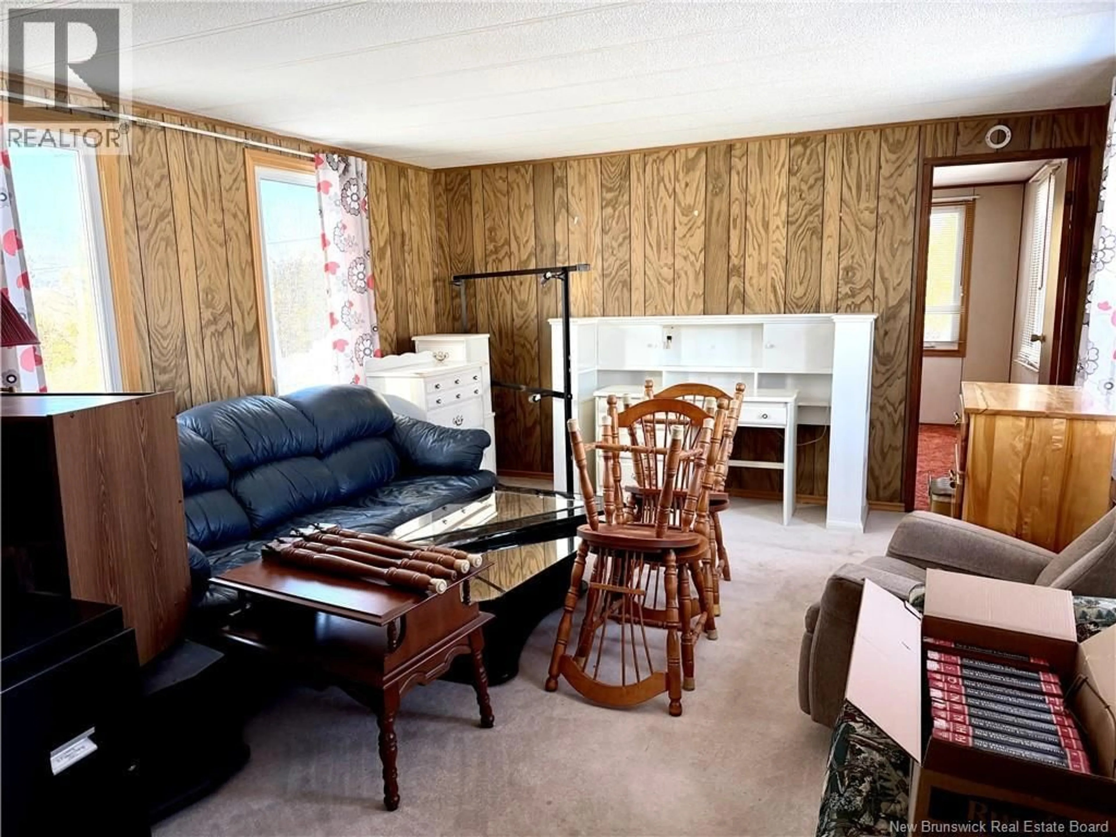 Living room with furniture, wood/laminate floor for 21 BOVAIRD STREET, Hampton New Brunswick E5N3A5