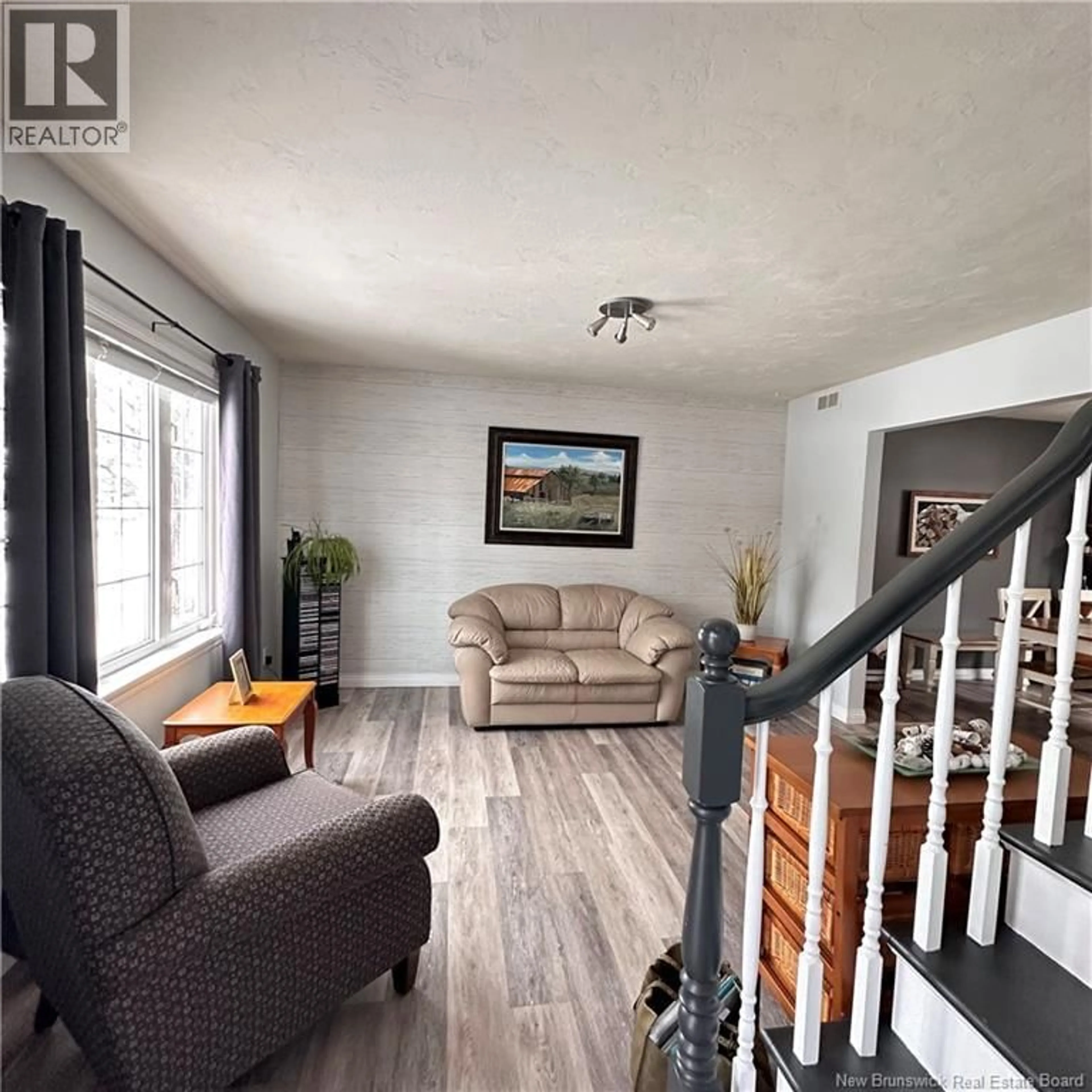 Living room with furniture, wood/laminate floor for 609 GREGOIRE, Dieppe New Brunswick E1A6X3