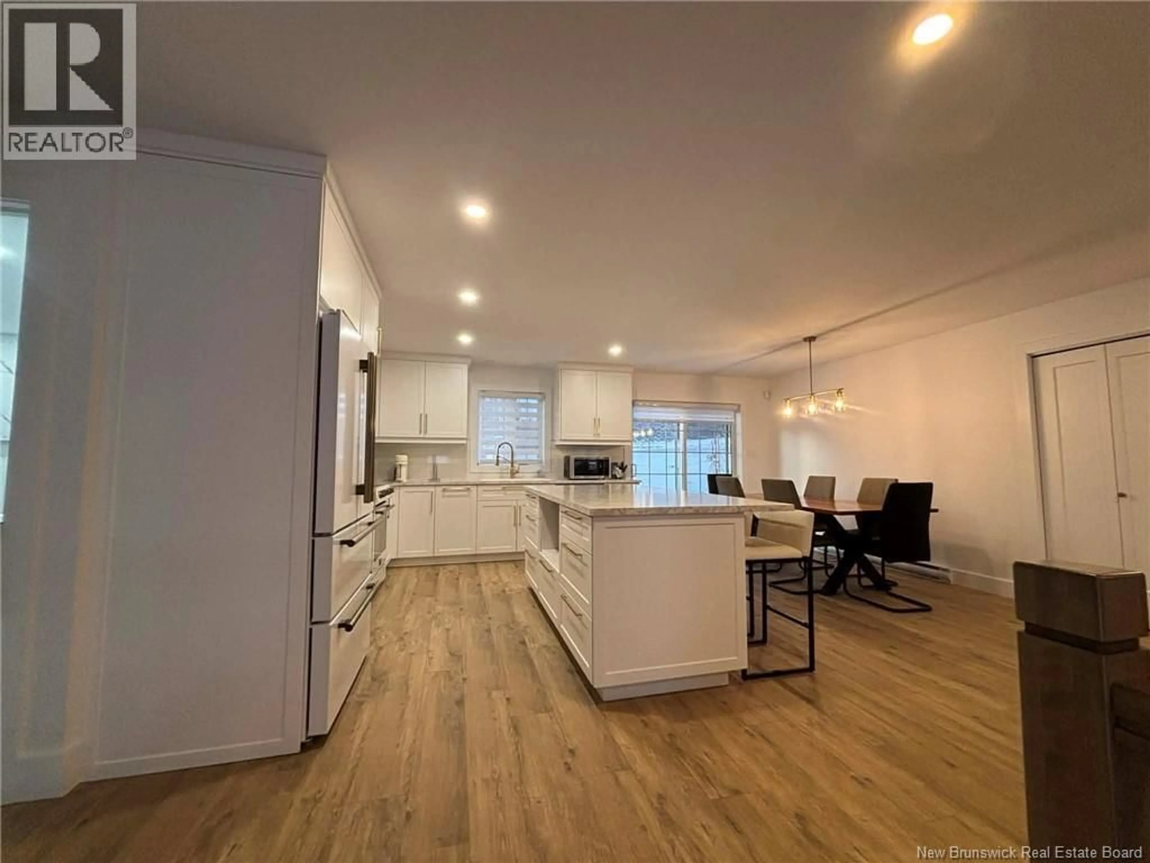 Open concept kitchen, wood/laminate floor for 2 BELANGER STREET, Kedgwick New Brunswick E8B1A6