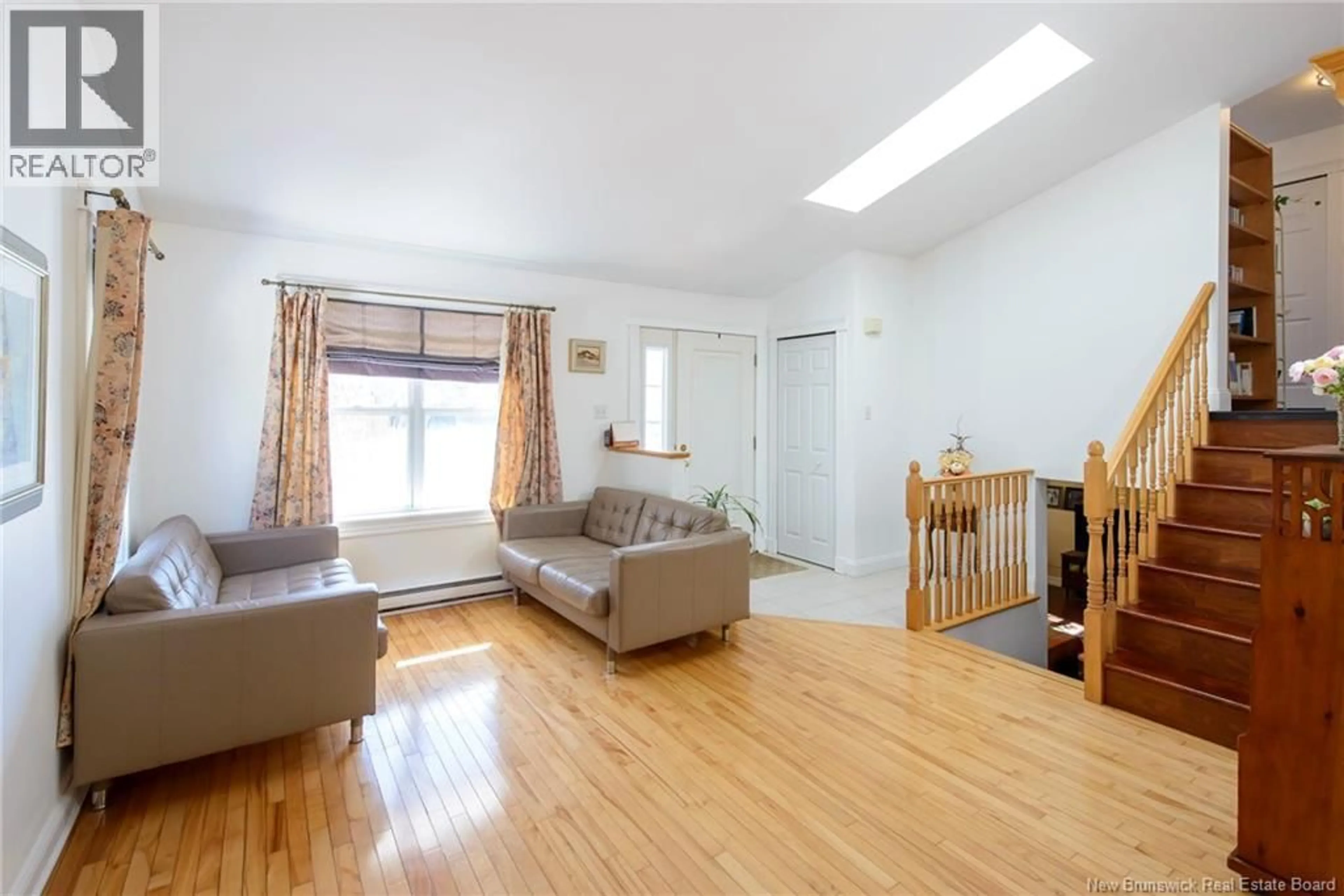 Living room with furniture, wood/laminate floor for 77 DONLYN DRIVE, Rothesay New Brunswick E2E4X7