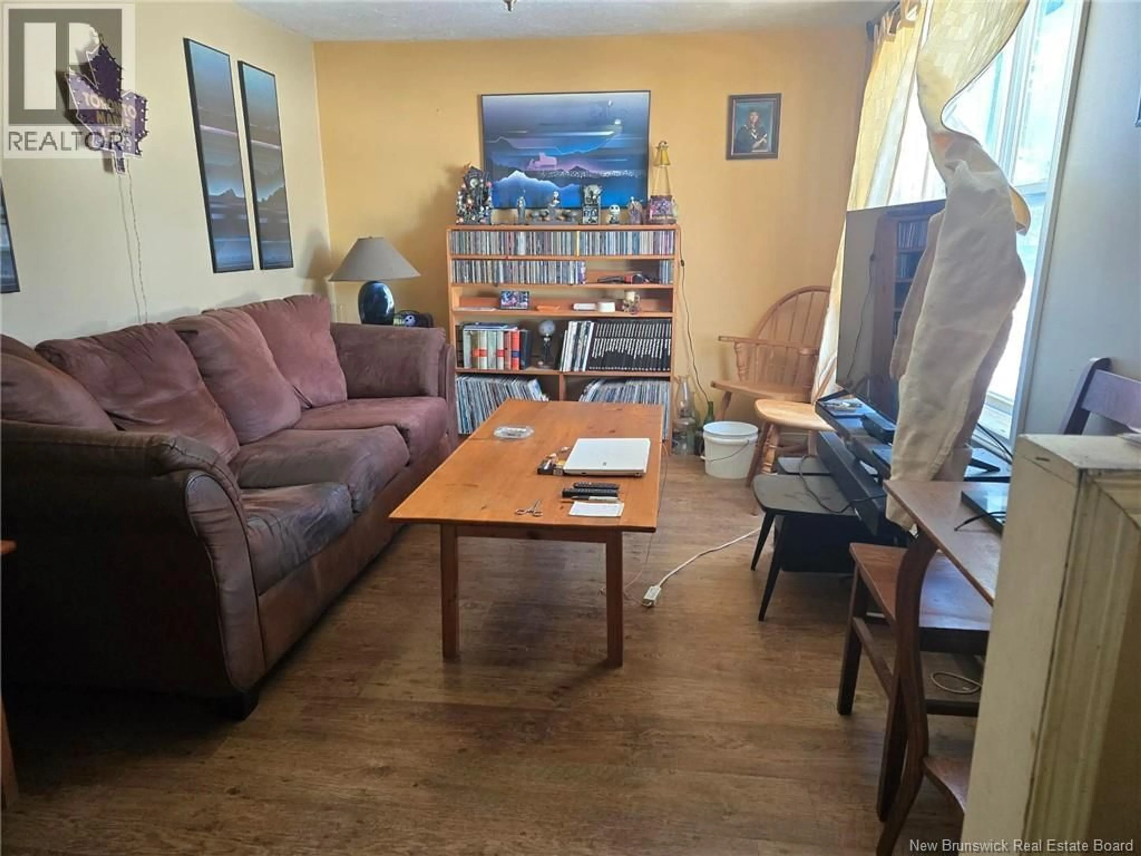 Living room with furniture, wood/laminate floor for 20 WAYNE AVENUE, Moncton New Brunswick E1C4B2