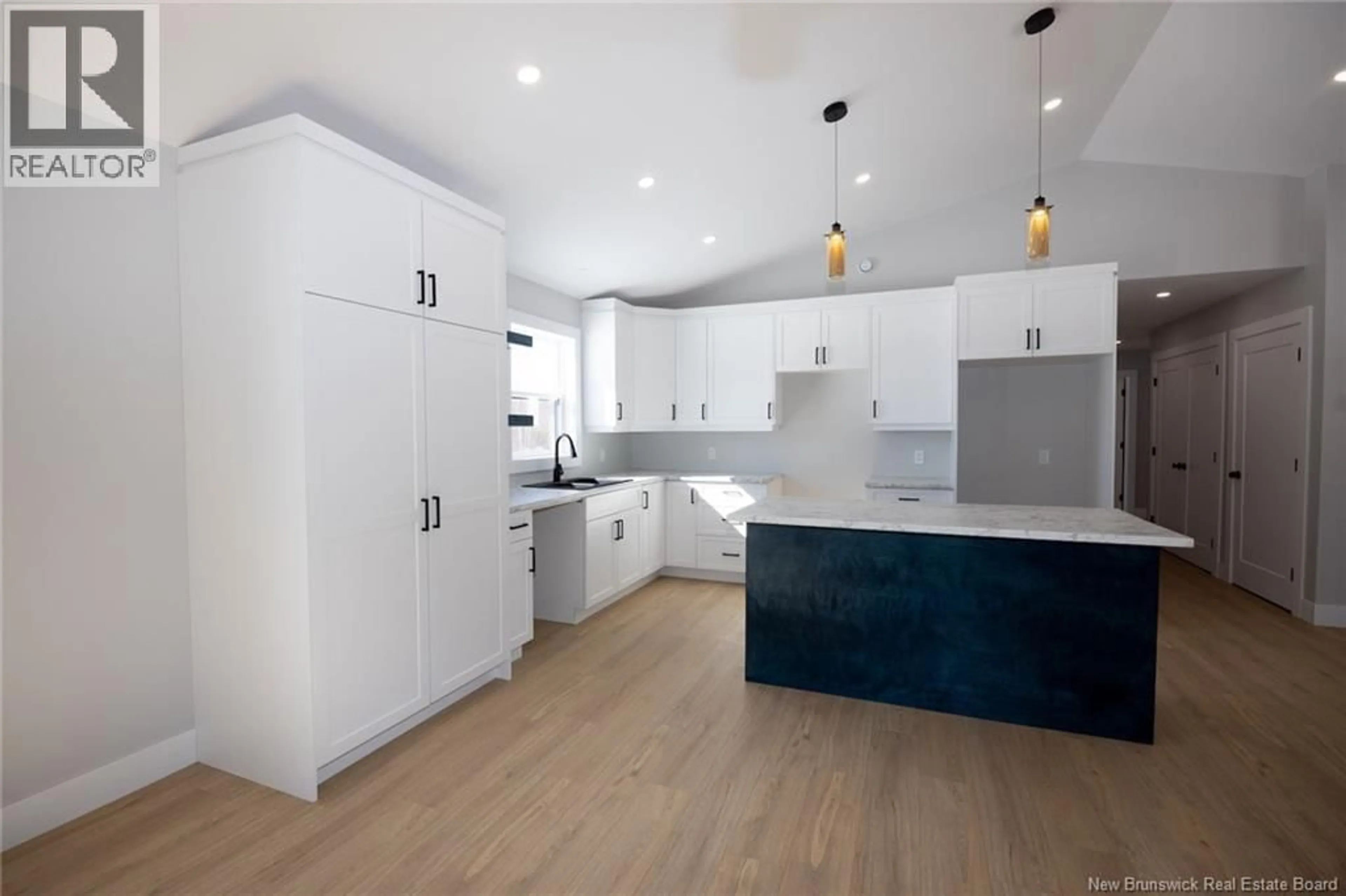 Open concept kitchen, wood/laminate floor for 496 ENGLISH SETTLEMENT ROAD, English Settlement New Brunswick E6B2G1