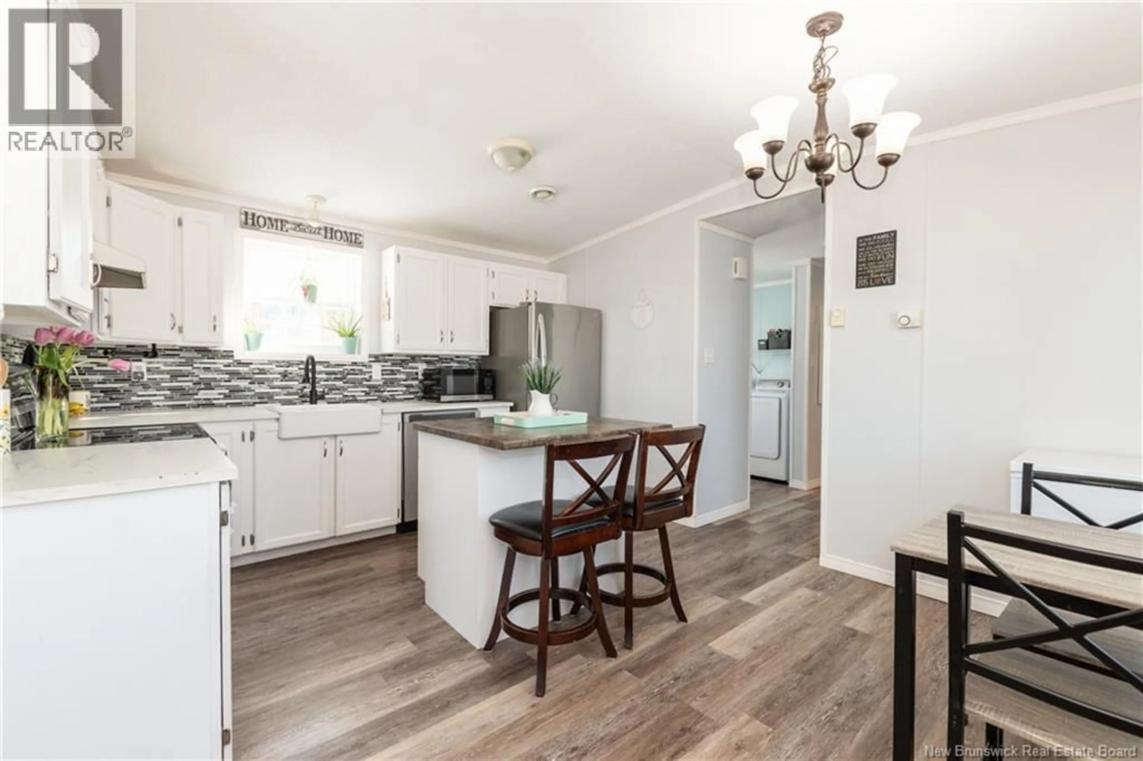 Open concept kitchen, wood/laminate floor for 68 HAYWARD LANE, Riverview New Brunswick E1B5R2