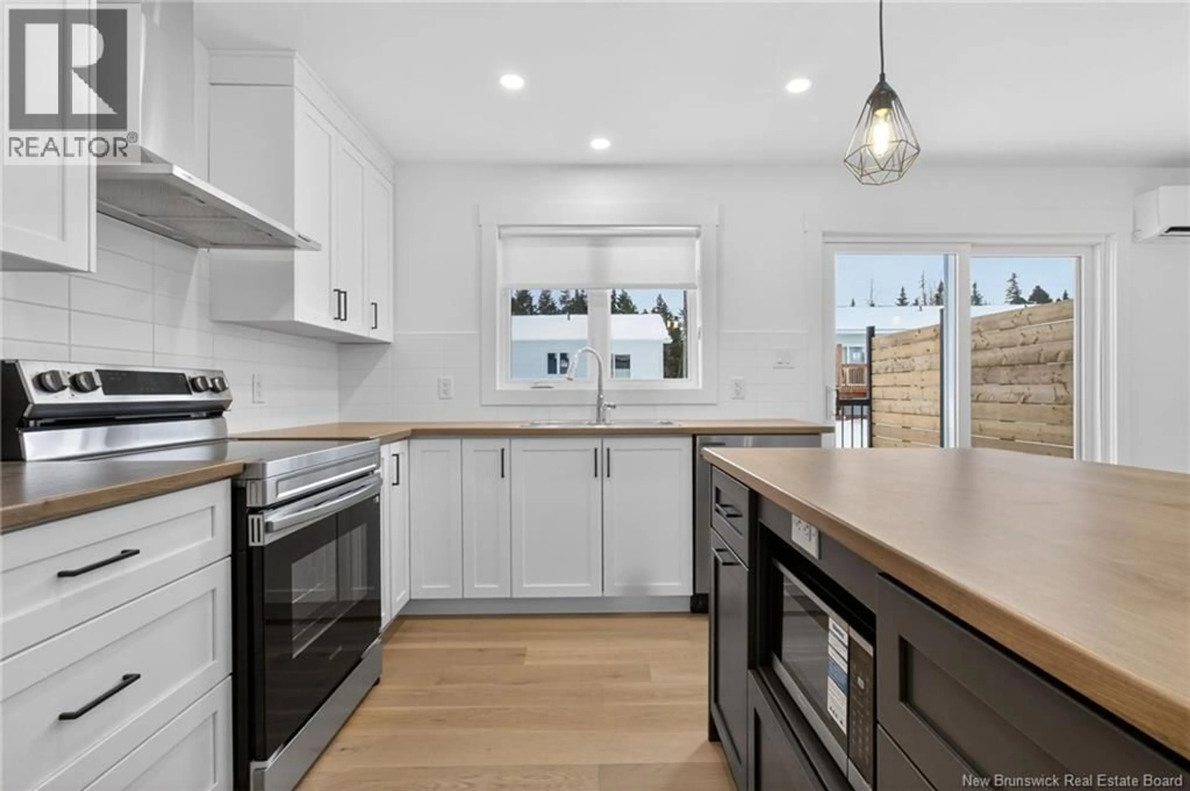 Open concept kitchen, ceramic/tile floor for 32 CEDRIC COURT, Dieppe New Brunswick E1A7K4