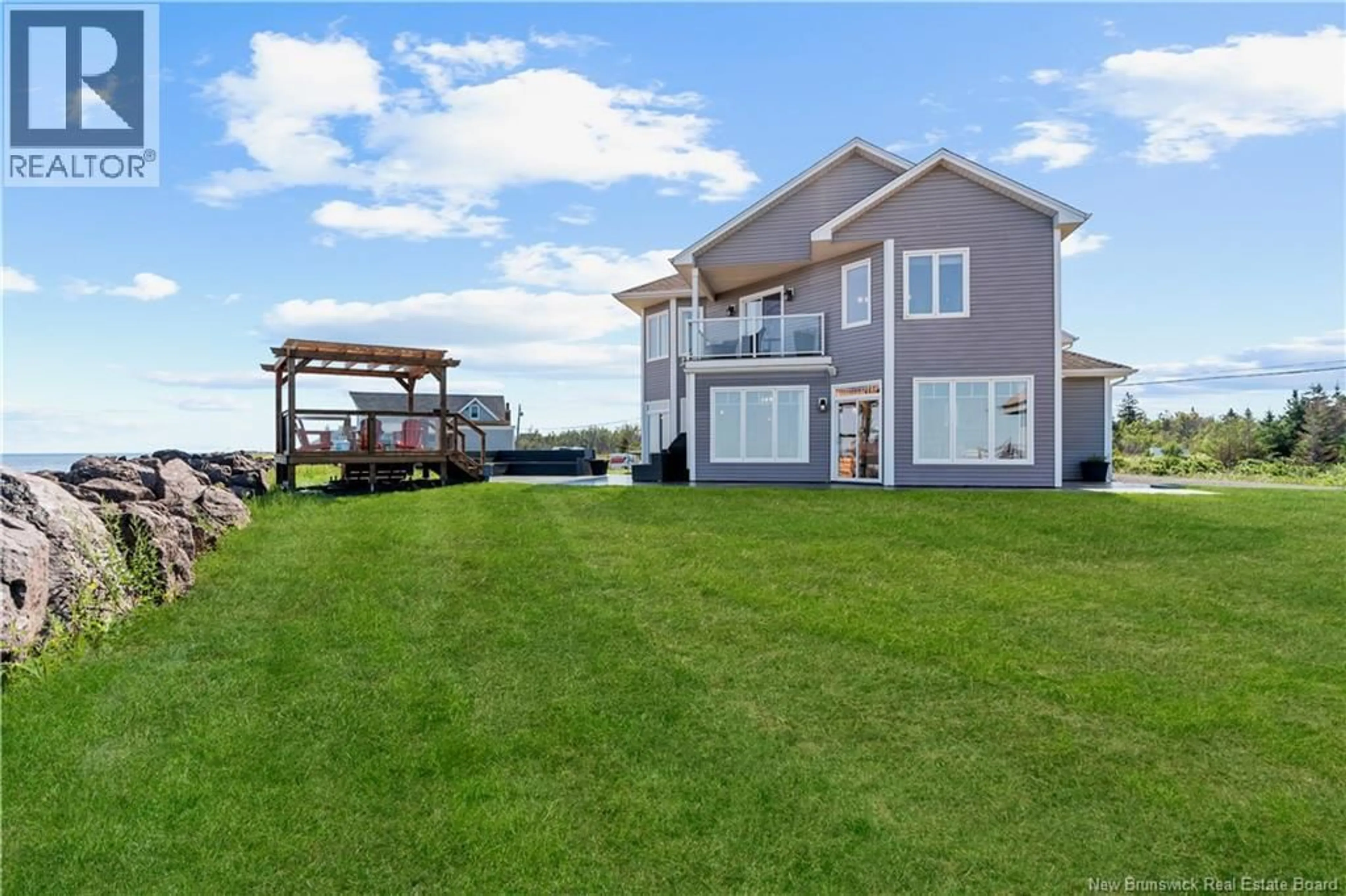 A pic from outside/outdoor area/front of a property/back of a property/a pic from drone, water/lake/river/ocean view for 41 P'TIT BARACHOIS, Grand-Barachois New Brunswick E4P7Y2