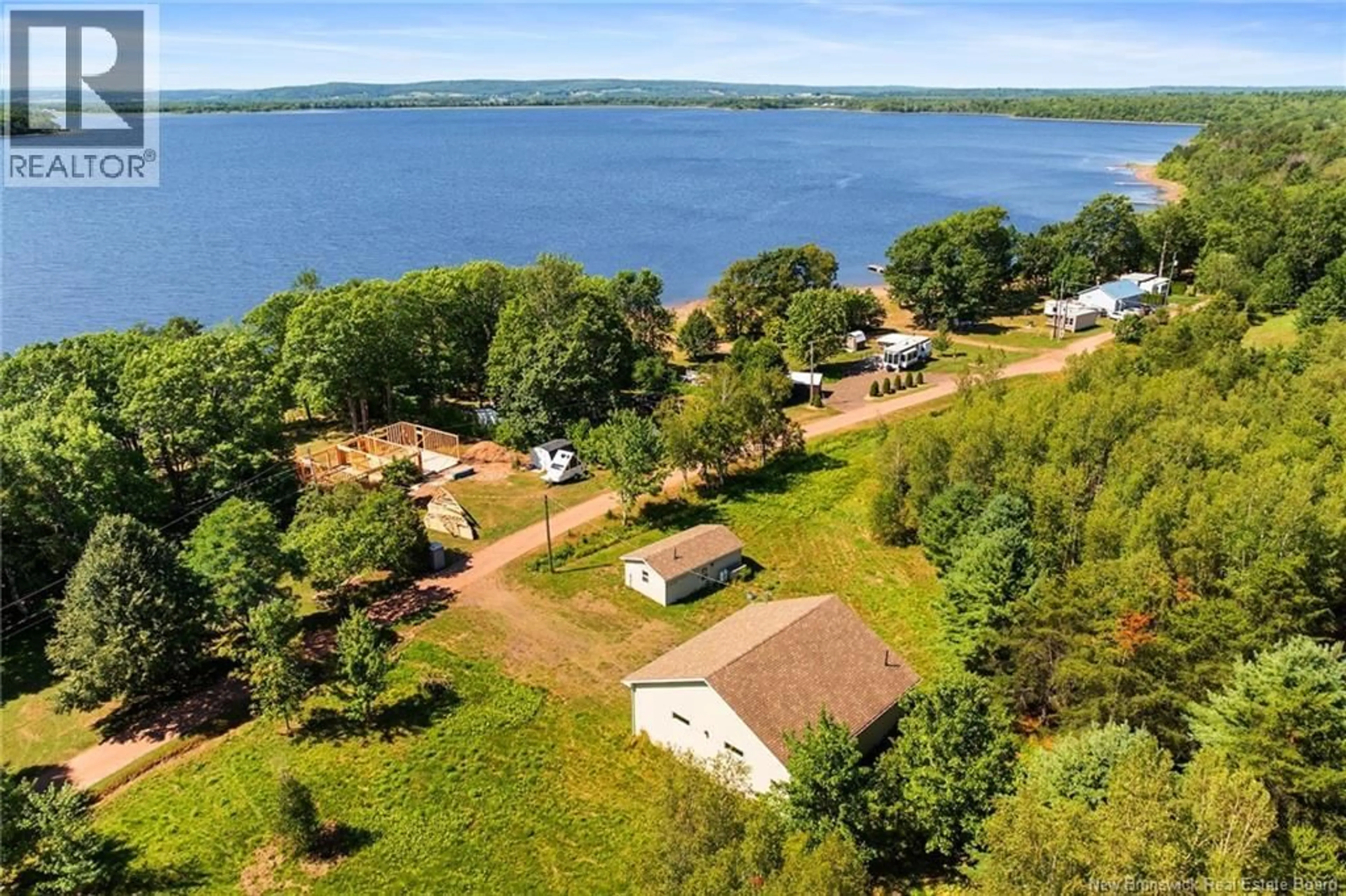 A pic from outside/outdoor area/front of a property/back of a property/a pic from drone, water/lake/river/ocean view for 34 WASHADEMOAK LANE, Cambridge-Narrows New Brunswick E4C4G7