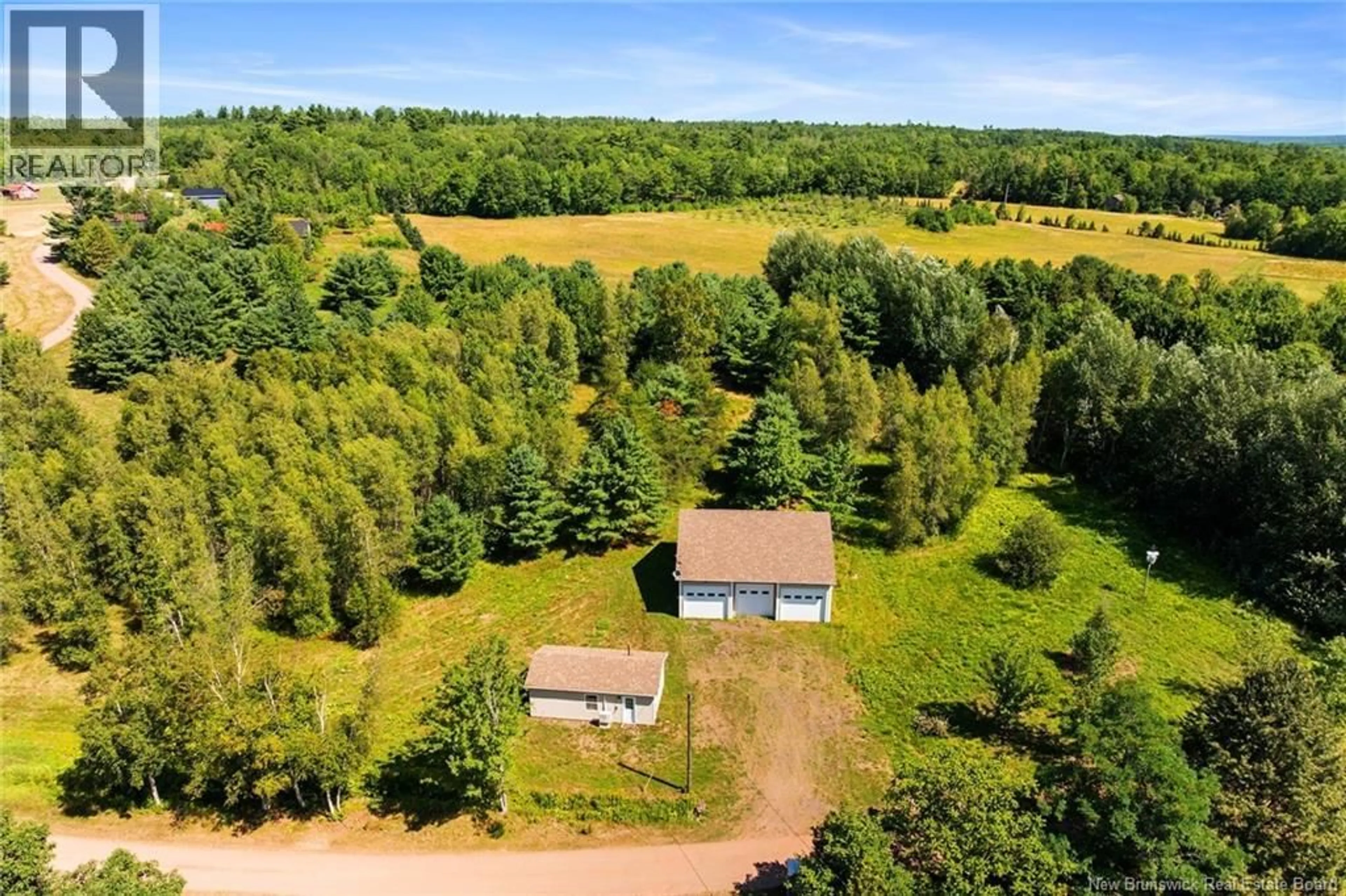 A pic from outside/outdoor area/front of a property/back of a property/a pic from drone, forest/trees view for 34 WASHADEMOAK LANE, Cambridge-Narrows New Brunswick E4C4G7