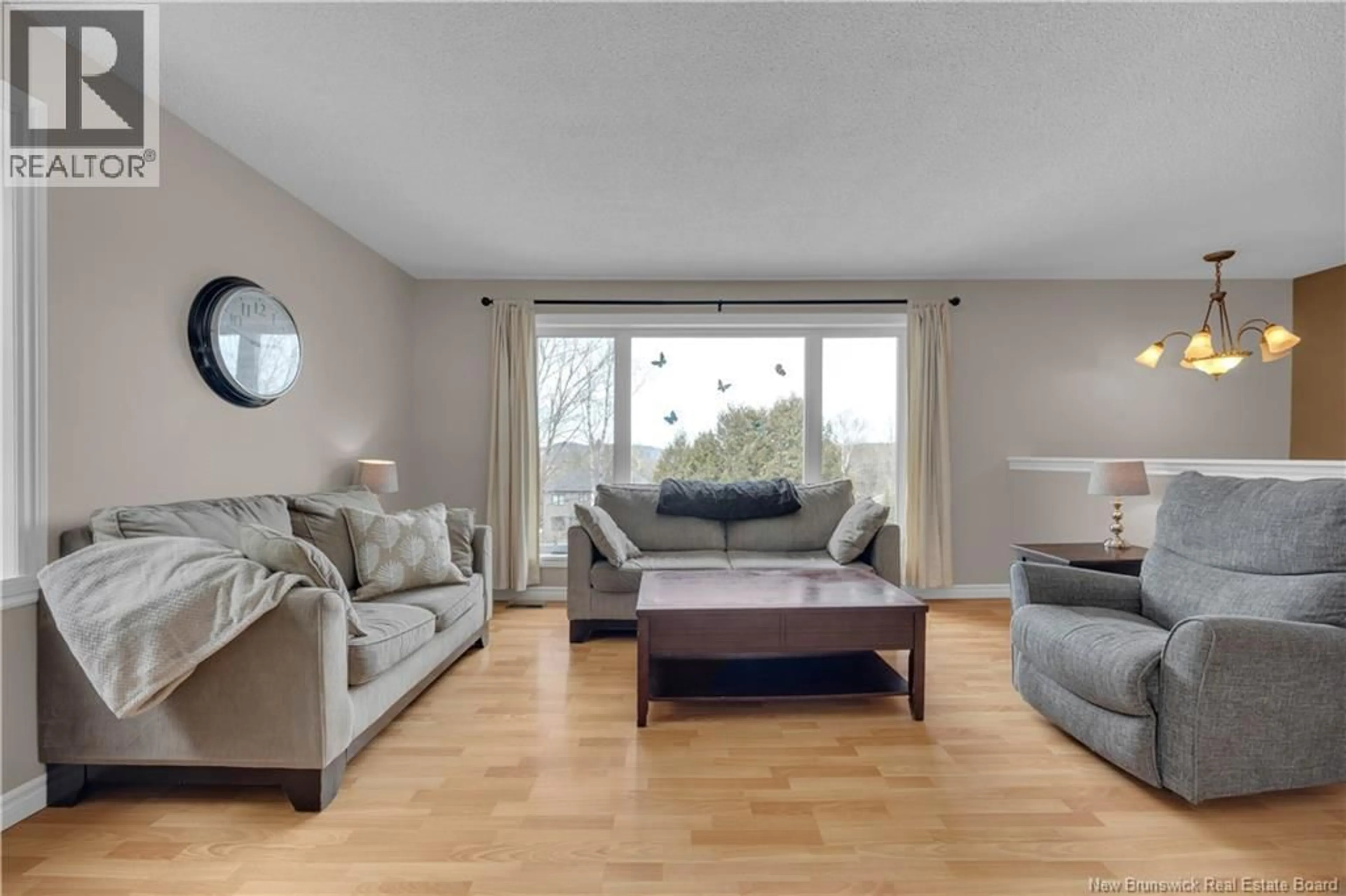 Living room with furniture, wood/laminate floor for 15 EXECUTIVE AVENUE, Quispamsis New Brunswick E2G1Y8