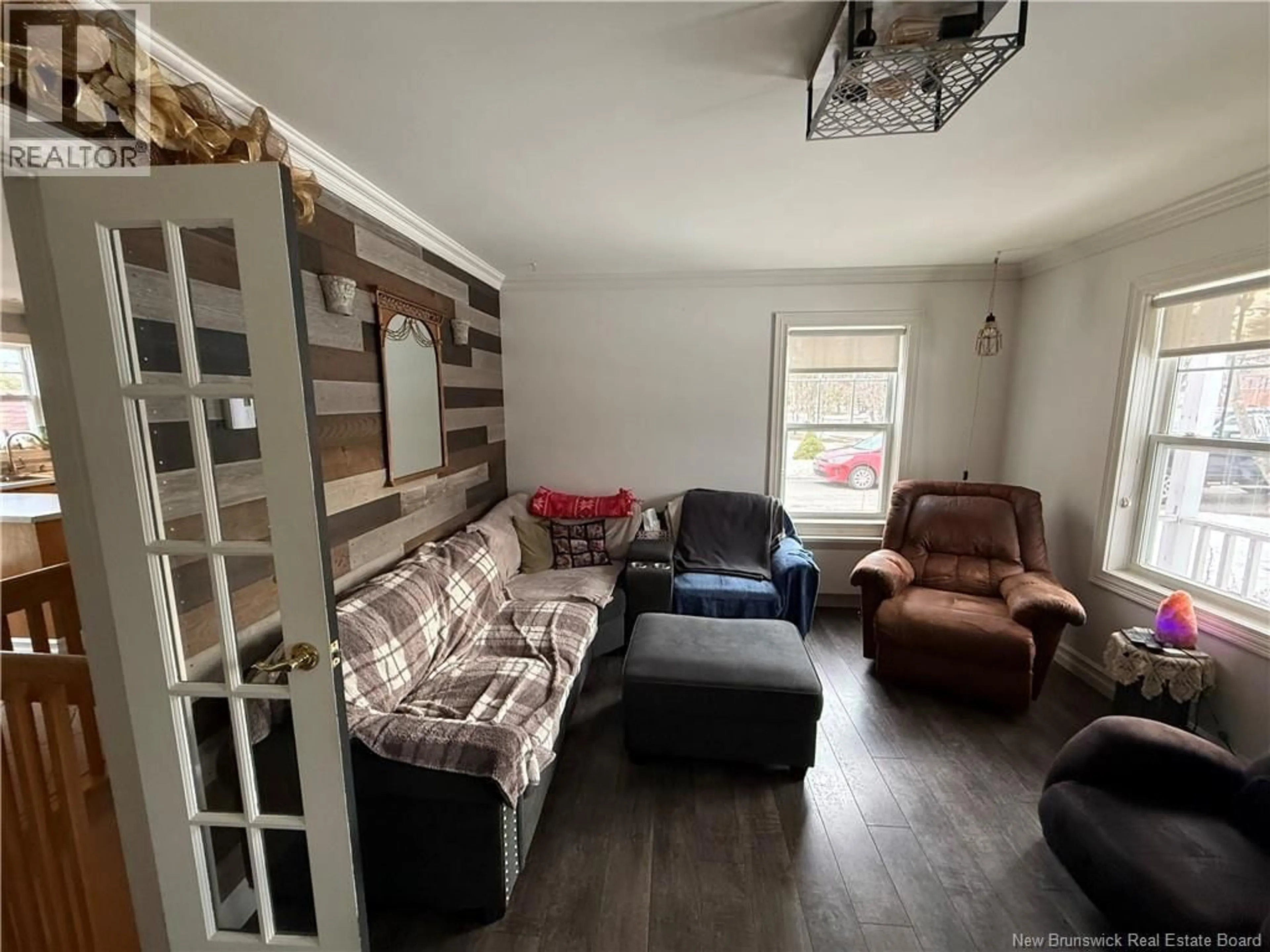 Living room with furniture, wood/laminate floor for 4318 BEAUREGARD STREET, Tracadie New Brunswick E1X1C4